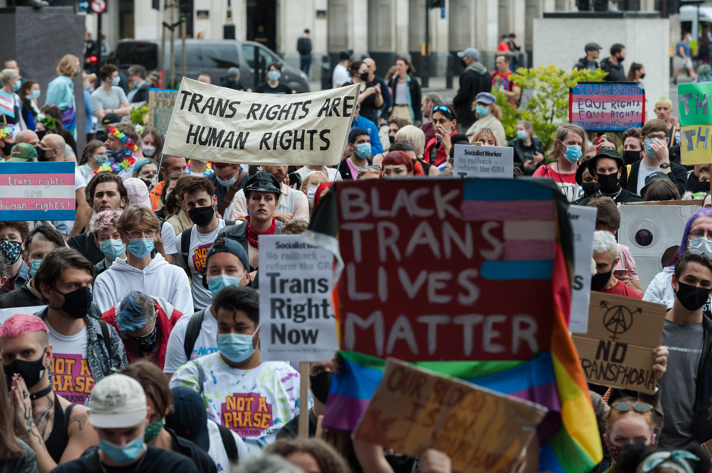 Transgender people and their supporters gather in Parliament Square to protest against potential changes to the Gender Recognition Act on July 4 in London
