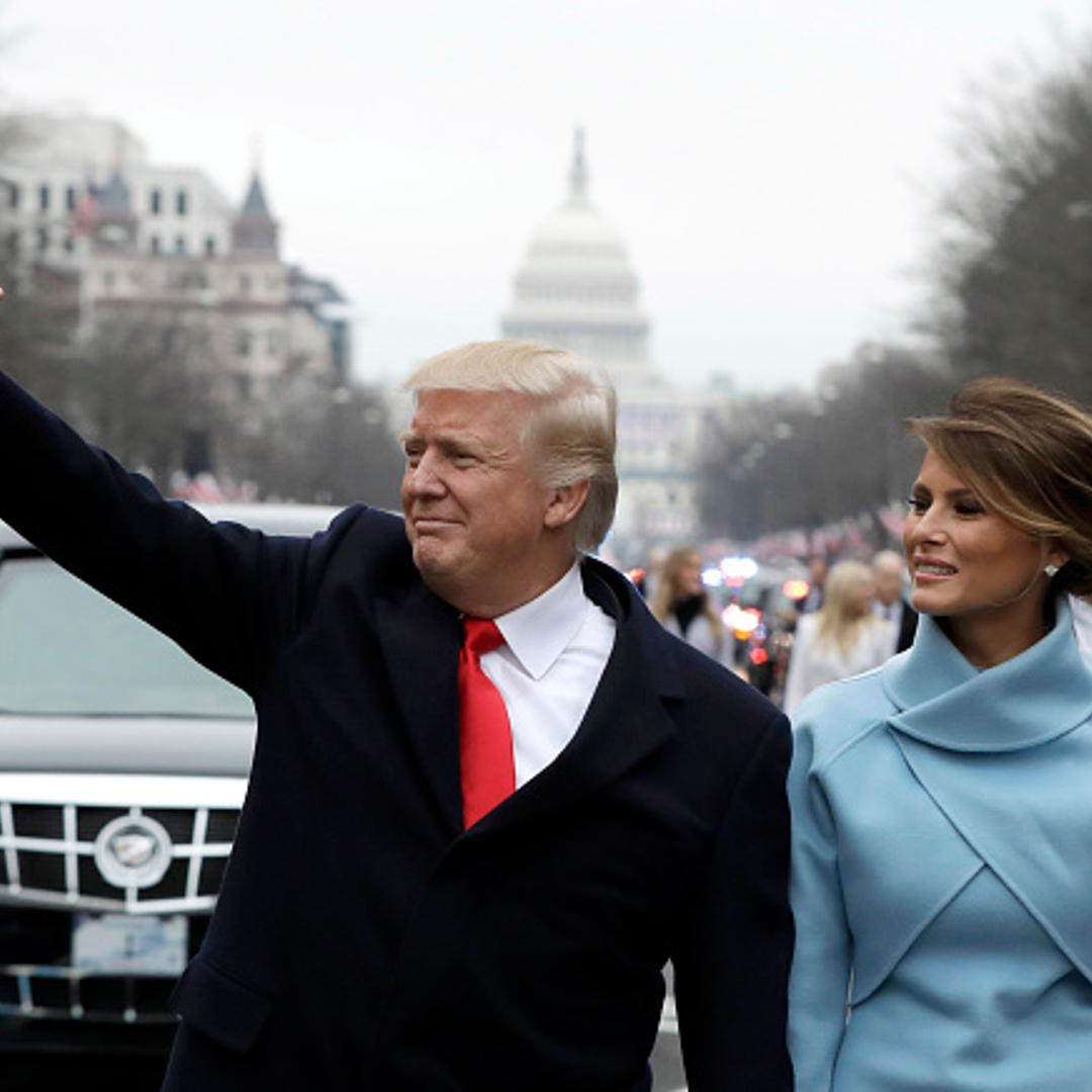 U.S. President Donald Trump waves to supporters as he walks the parade route with first lady Melania Trump after being sworn in at the 58th Presidential Inauguration January 20, 2017 in Washington, D.C.