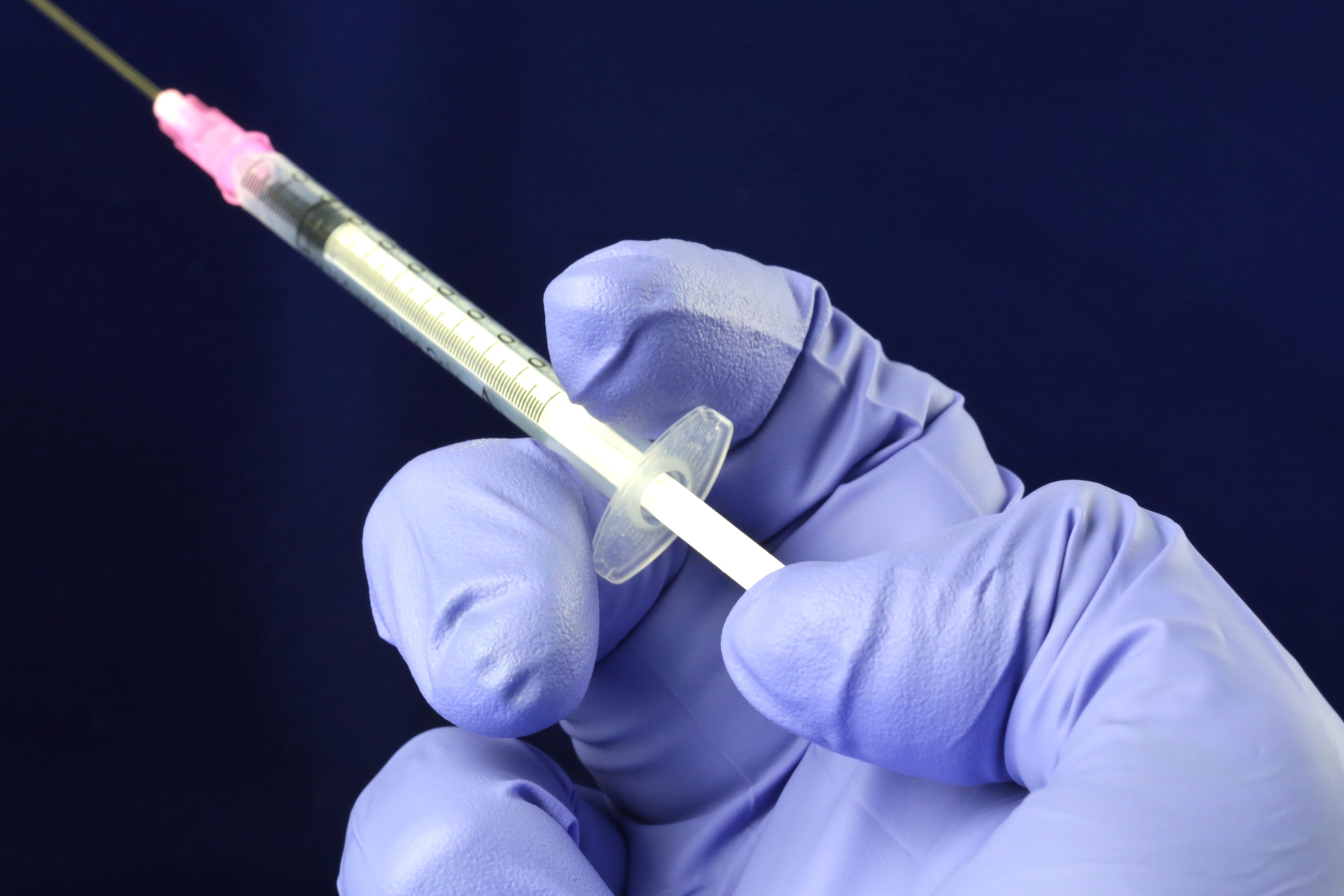 A health worker prepares a vaccine