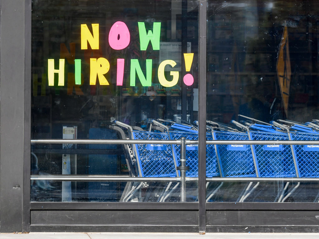 Help Wanted Sign In Store Window In Muhlenberg Pennsylvania