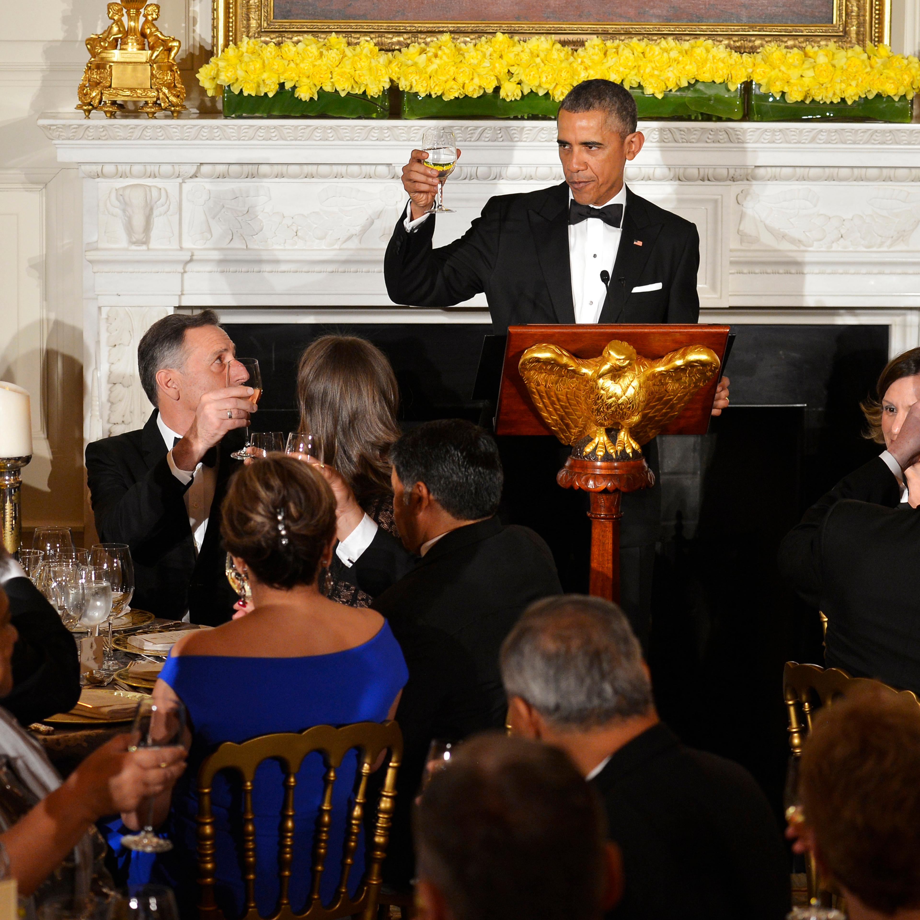 U.S. President Barack Obama toasts attendees from the National Governors Association at a dinner in the White House