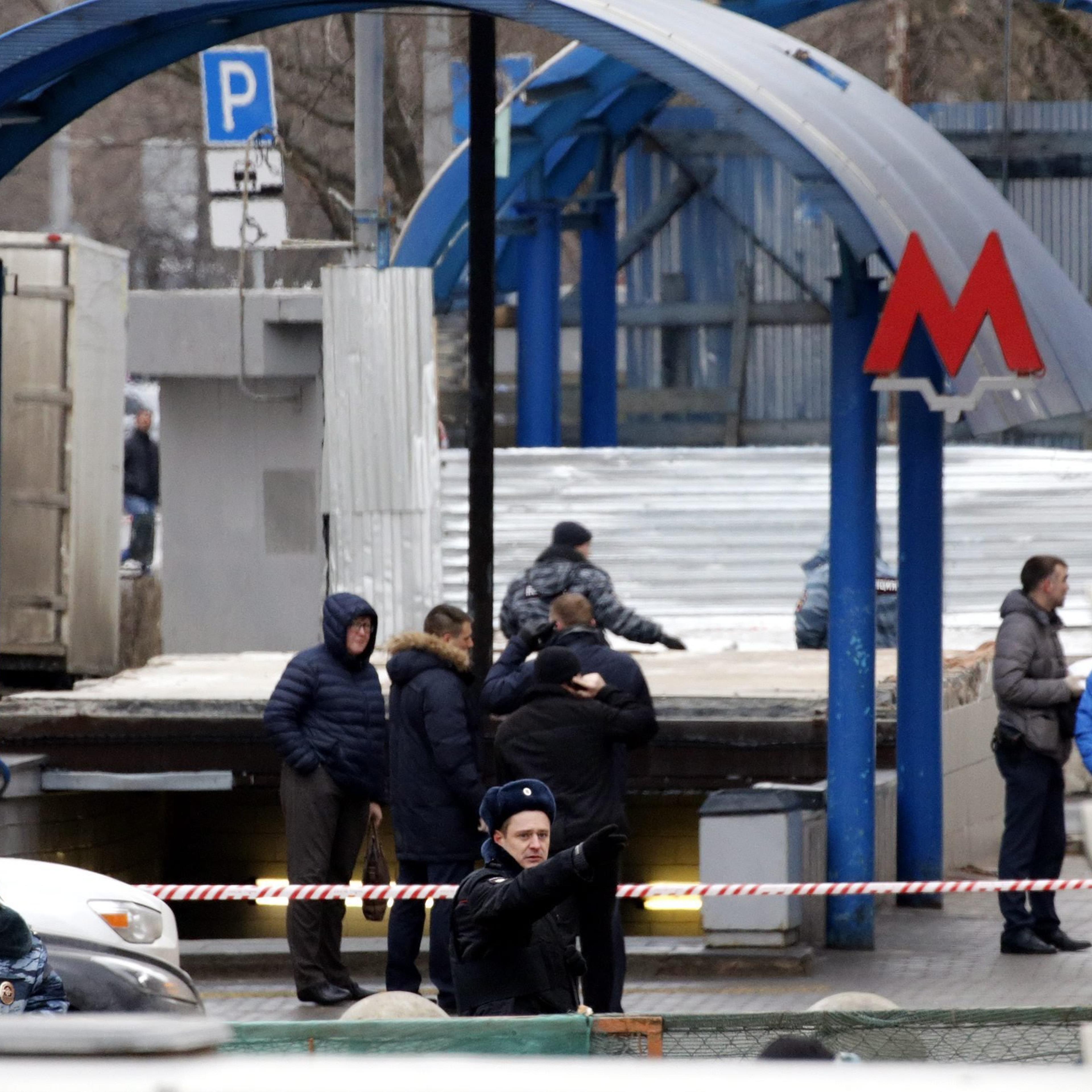 Investigators and police inspect the site near the Oktyabrskoye Pole underground station where a woman carrying a severed child's head was arrested in Moscow, Russia on Feb. 29 2016.