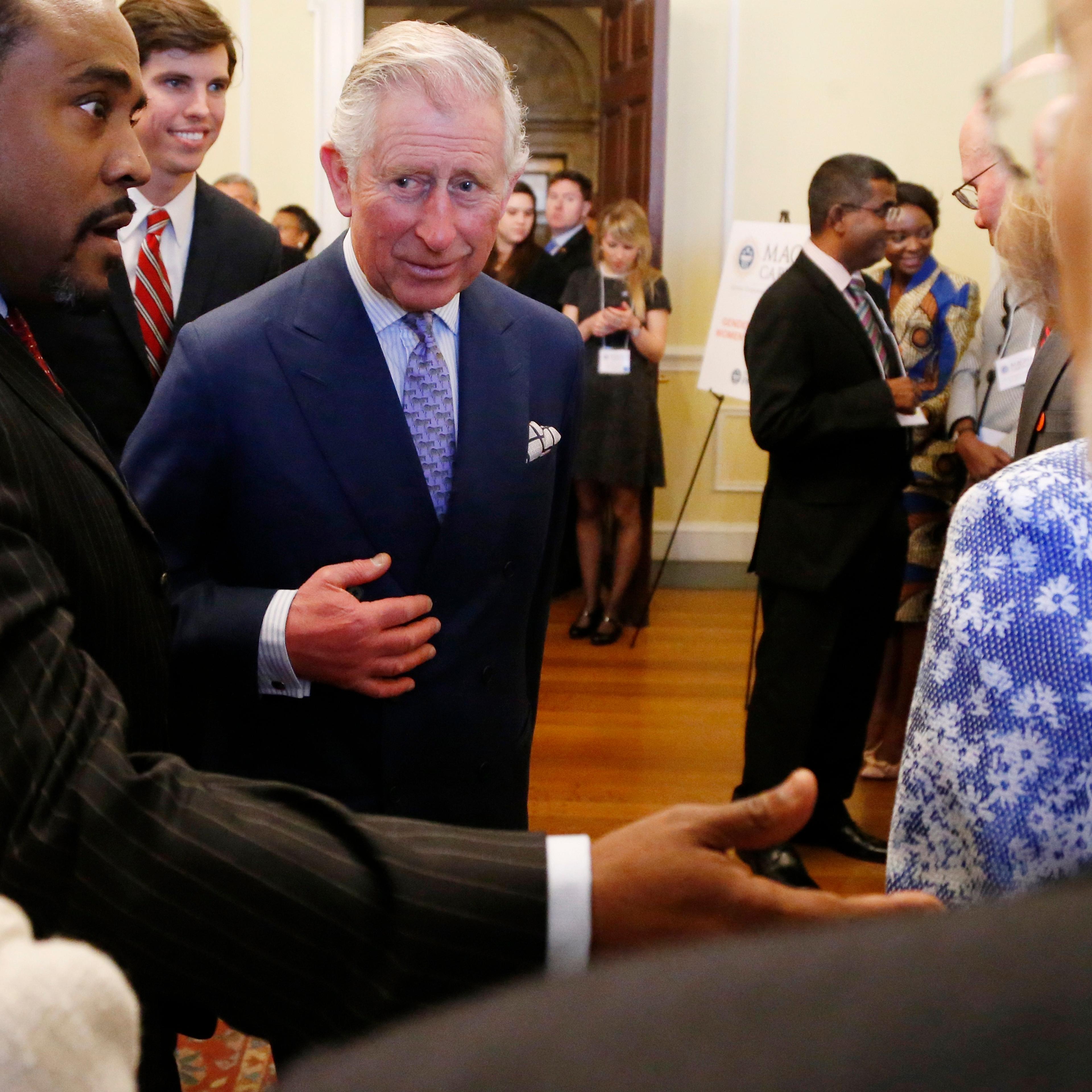 Britain's Prince Charles greets participants in a conference about the rule of law in the 21st century as he visits the National Archives in Washington