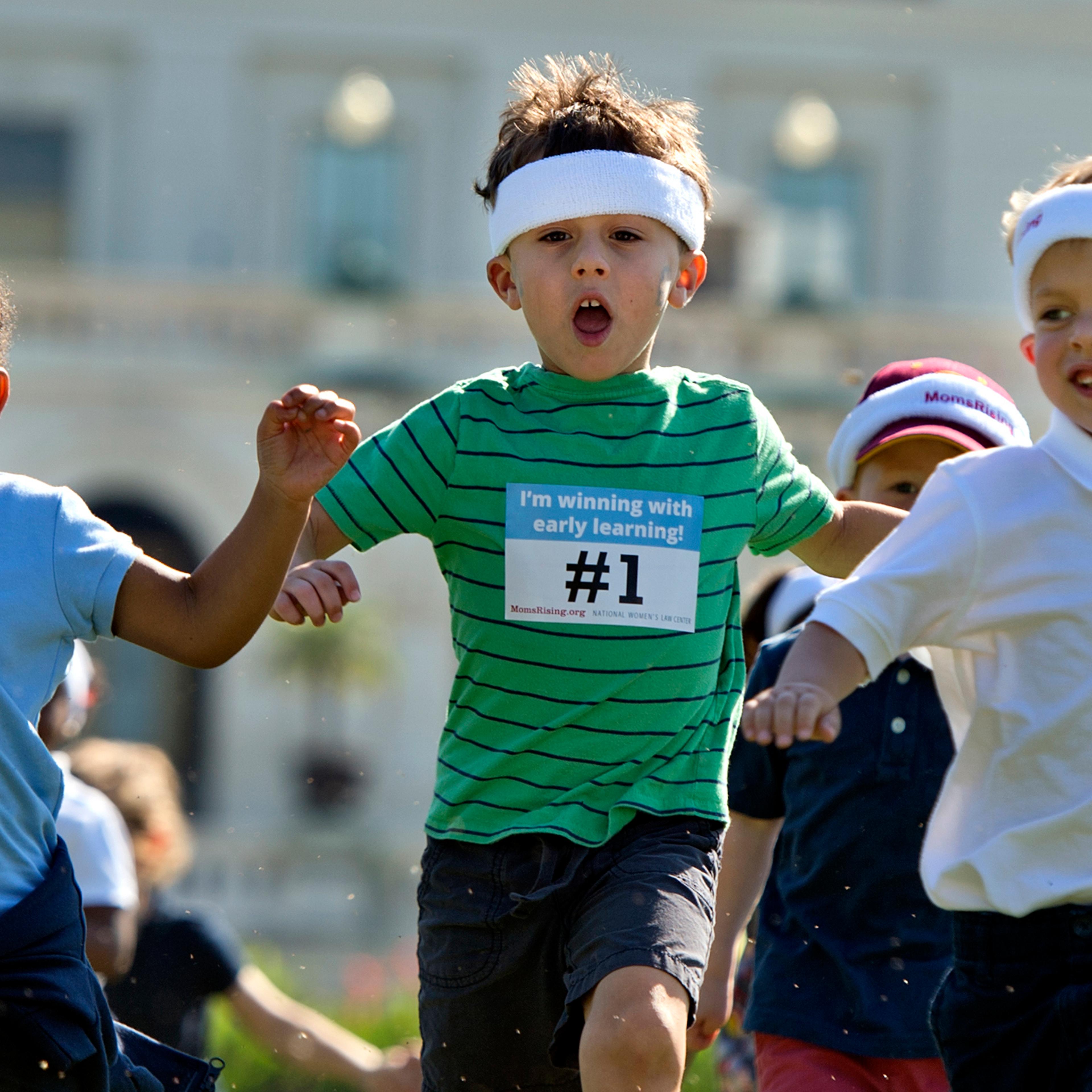 Children run a relay race during an event to highlight the importance of affordable child care and early learning programs on Sept. 17, 2015.