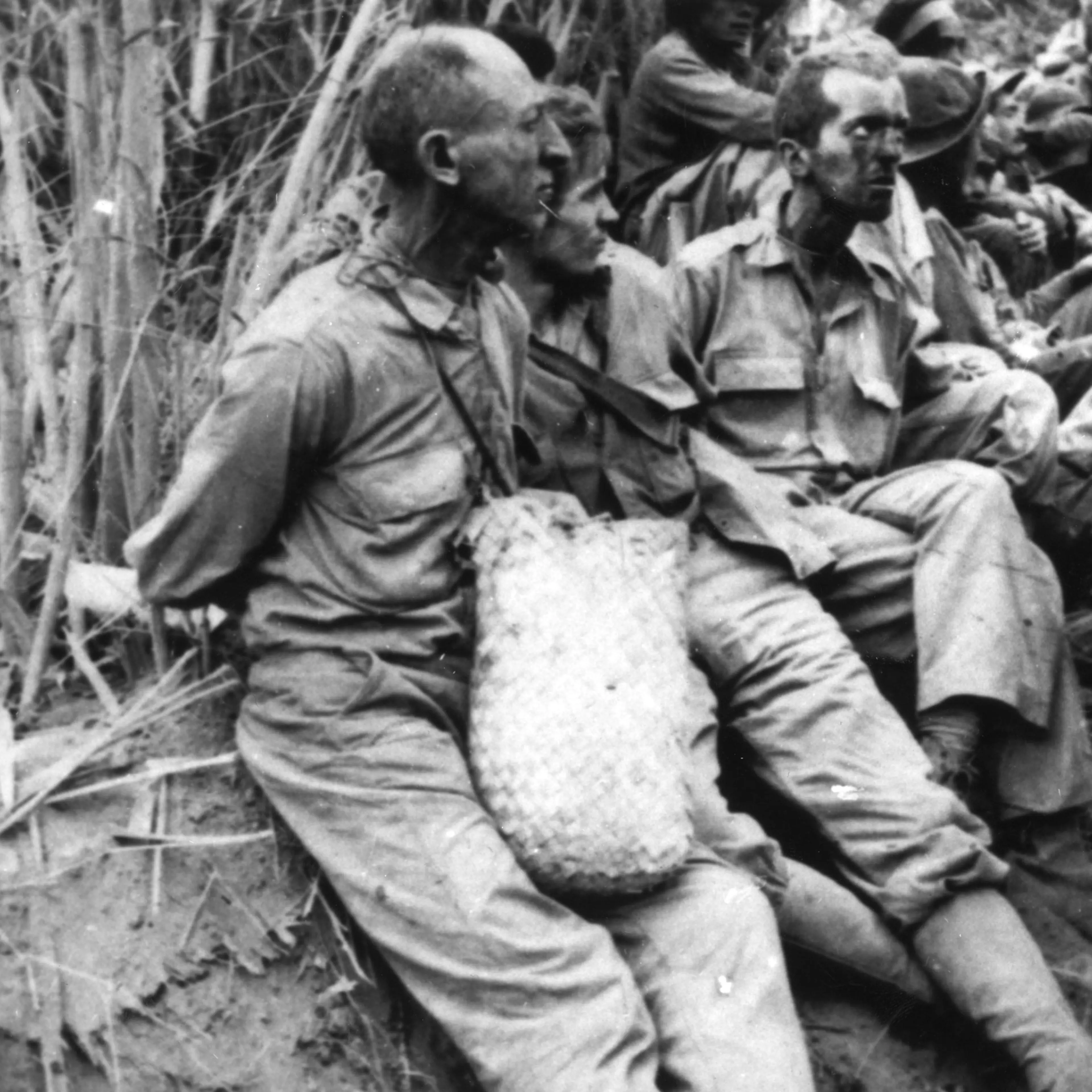 American and Filipino prisoners of war during the Bataan Death march when the Japanese force-marched them across the Philippines, May 1942.