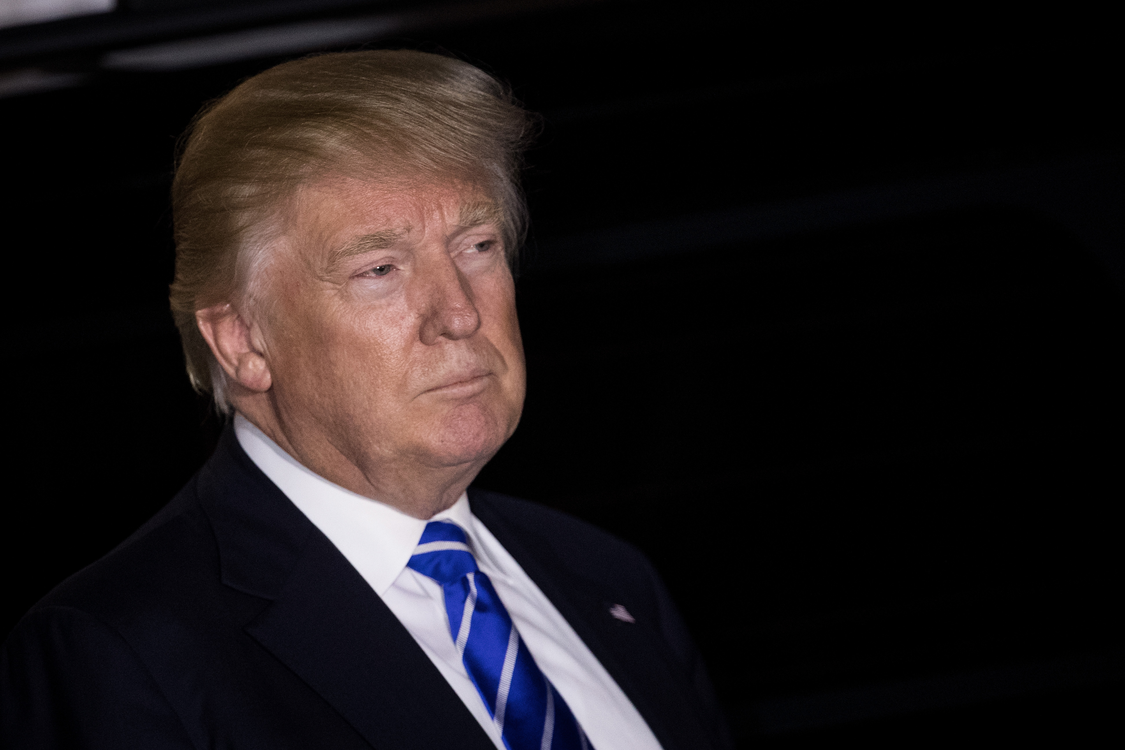 President-elect Donald Trump listens to questions from the press as he exits the clubhouse after a day of meetings at Trump International Golf Club, in Bedminster Township, N.J., on Nov. 19, 2016.