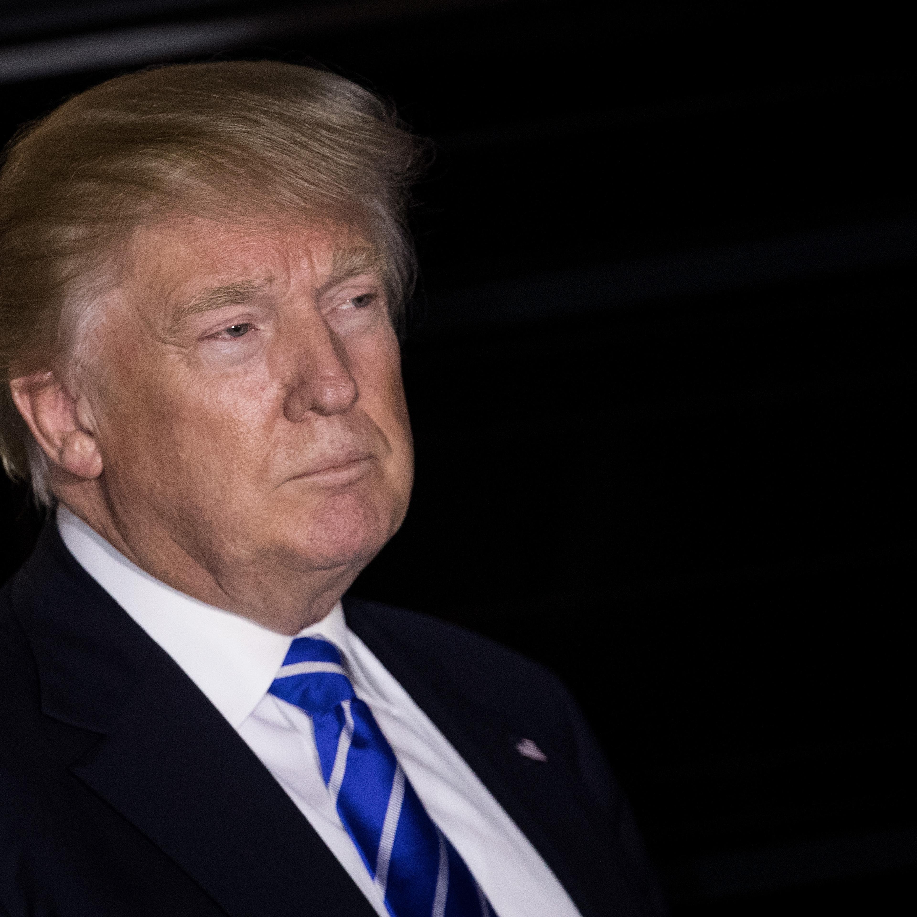President-elect Donald Trump listens to questions from the press as he exits the clubhouse after a day of meetings at Trump International Golf Club, in Bedminster Township, N.J., on Nov. 19, 2016.