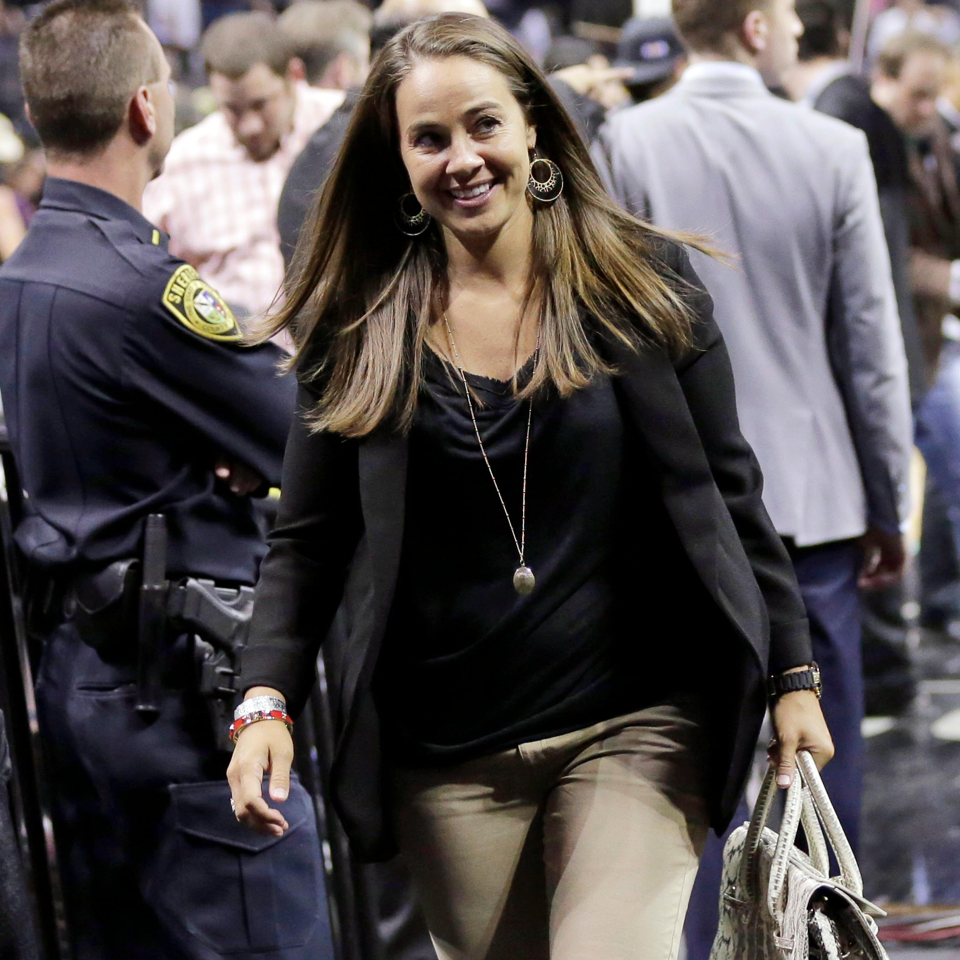 San Antonio Stars' Becky Hammon walks off the court following Game 5 of the opening-round NBA basketball playoff series between the San Antonio Spurs and the Dallas Mavericks in San Antonio on April 30, 2014