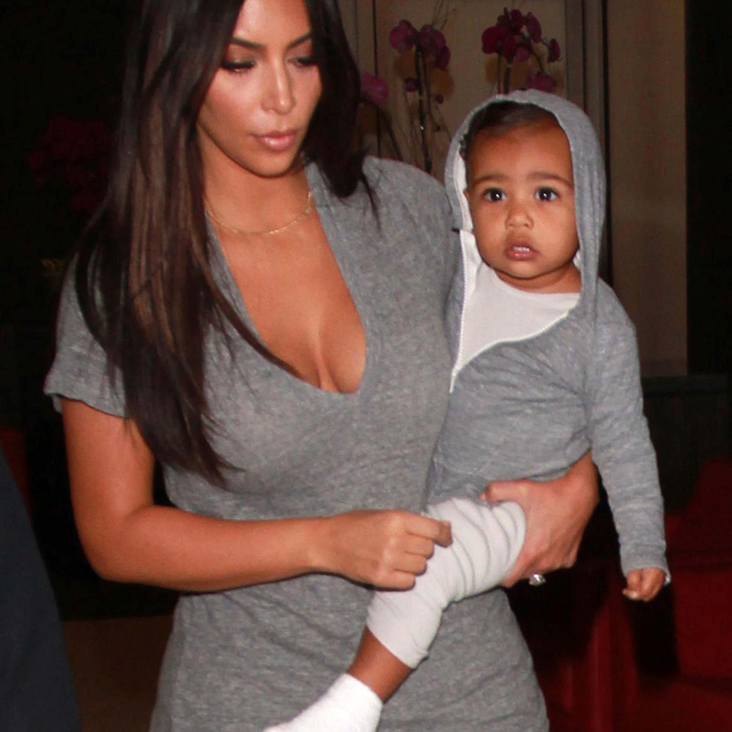 Kim Kardashian takes baby North West on late night flight from LAX Airport