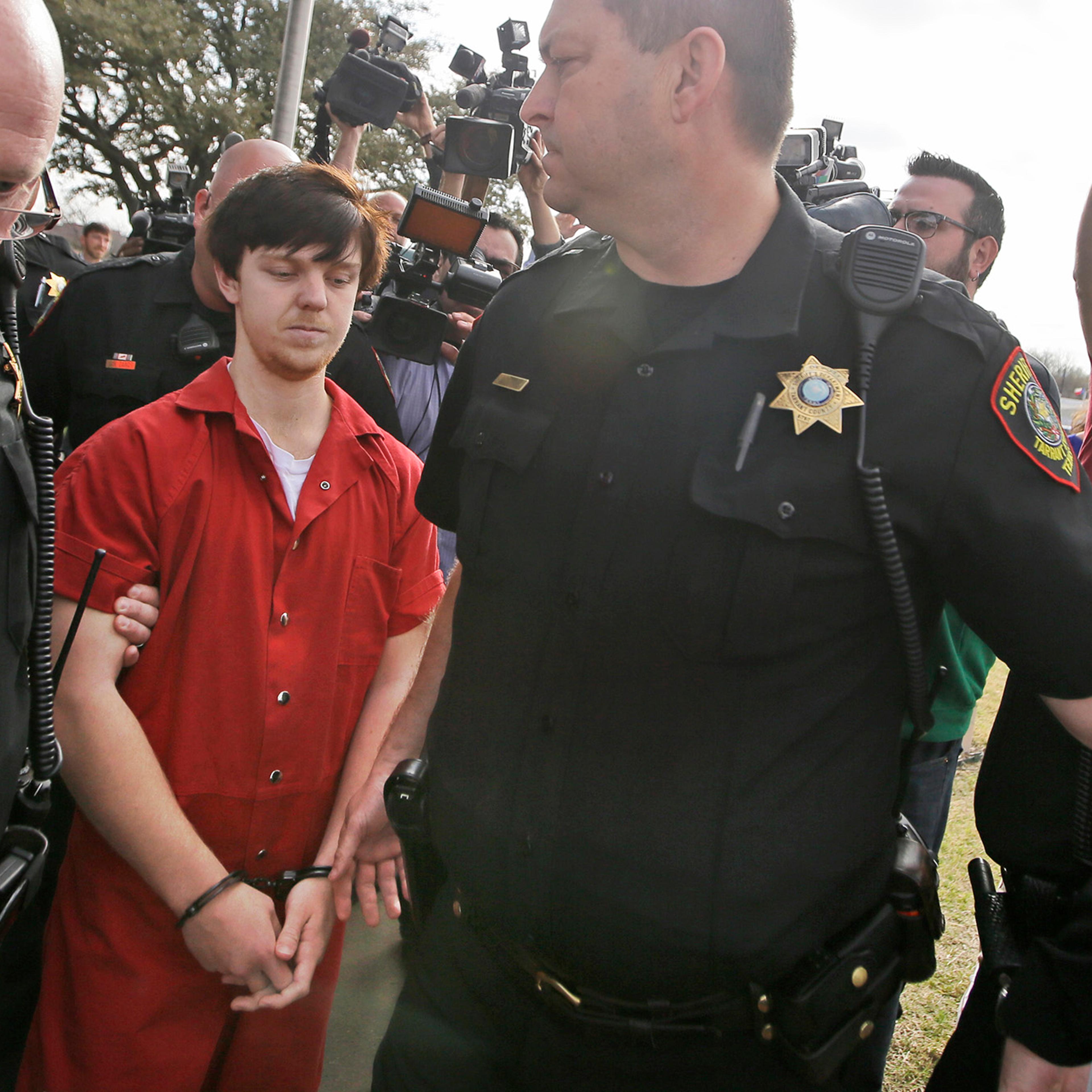Ethan Couch is led by sheriff deputies to a waiting SUV after a juvenile court for a hearing in Fort Worth, Texas on Feb. 19, 2016.