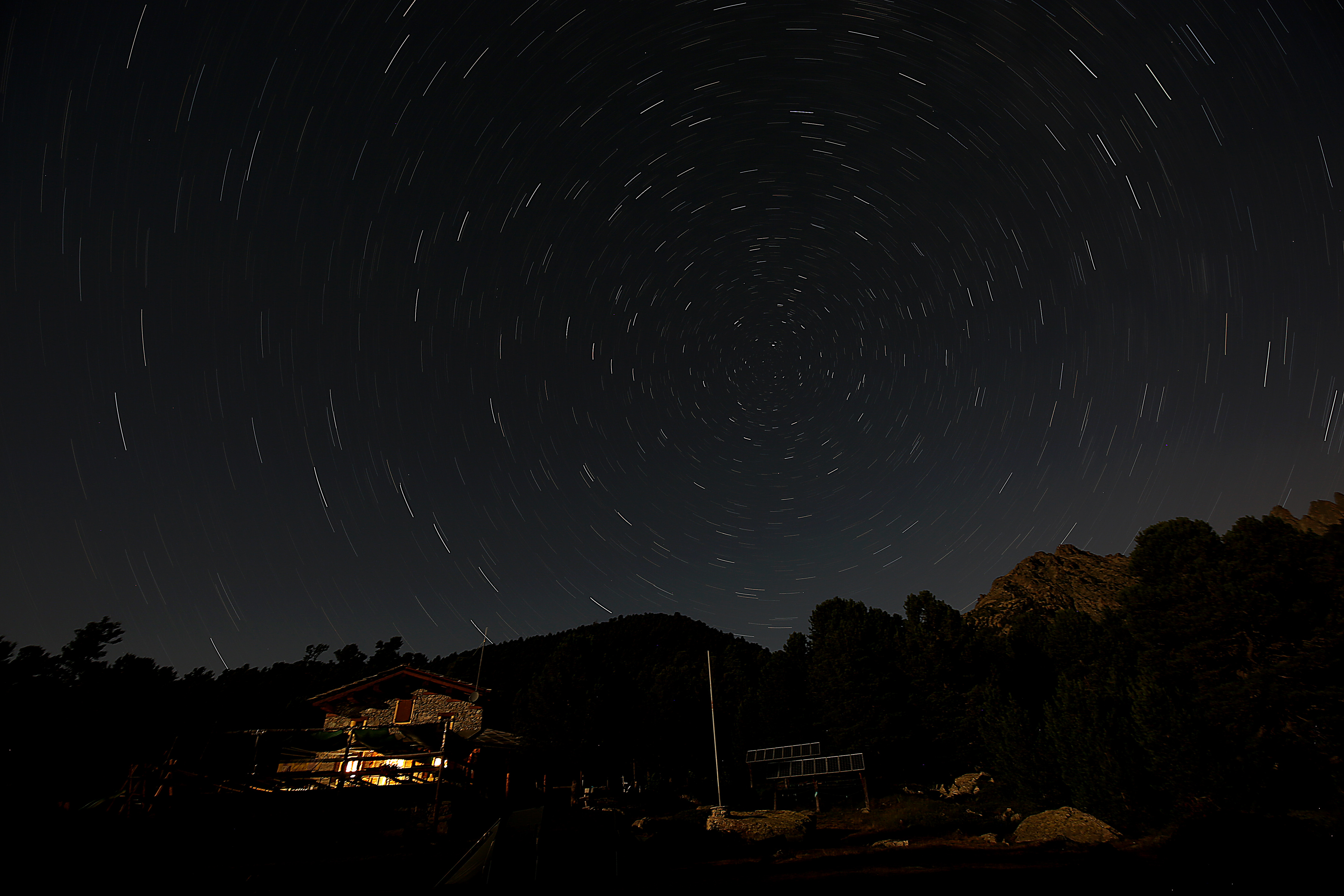 The Bagnour alpine refuge is seen at night during the annual Perseid meteor shower in the Aleve wood in Pontechianale, near Cuneo, in the Monte viso Alps, northern Italy, on Aug. 13, 2016.