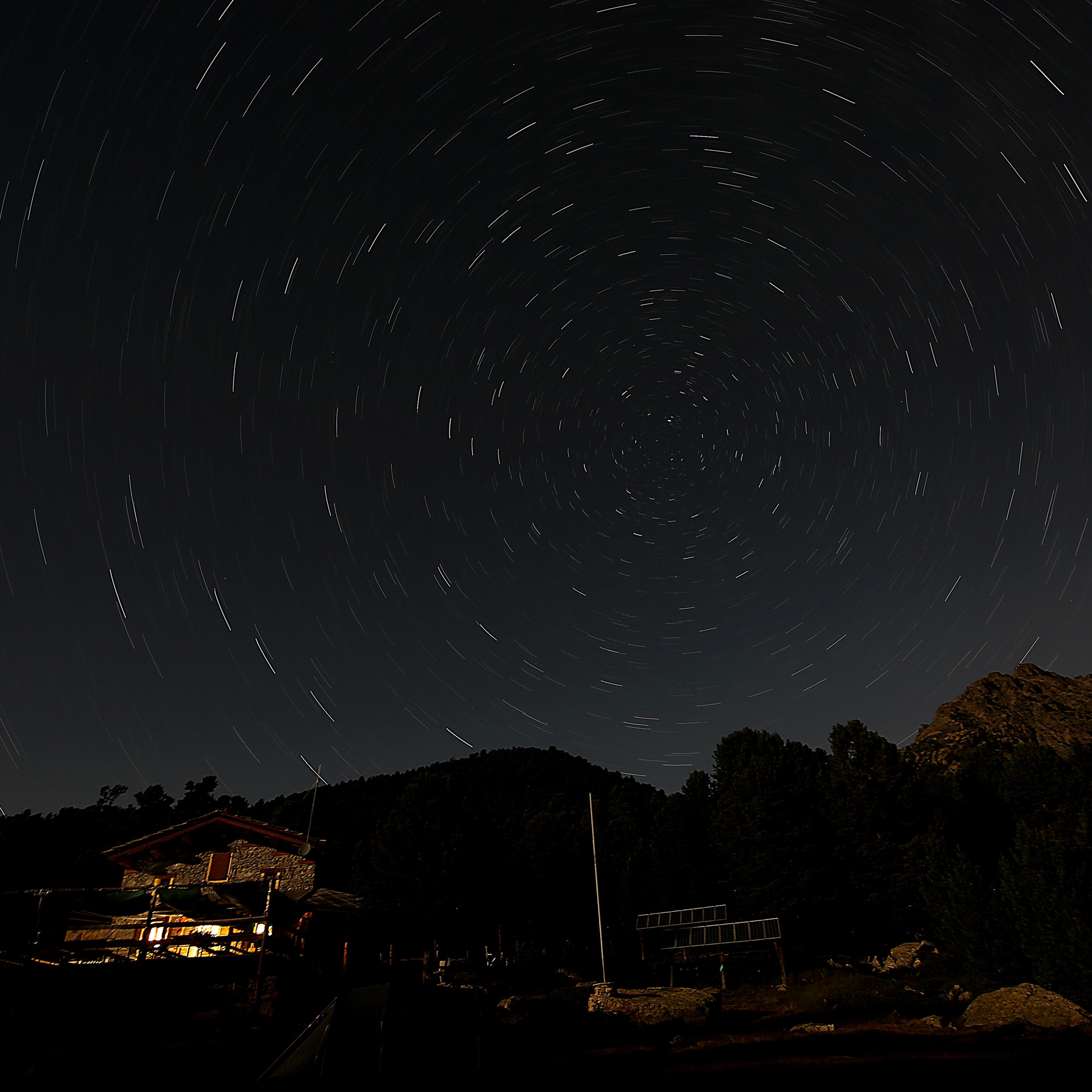 The Bagnour alpine refuge is seen at night during the annual Perseid meteor shower in the Aleve wood in Pontechianale, near Cuneo, in the Monte viso Alps, northern Italy, on Aug. 13, 2016.