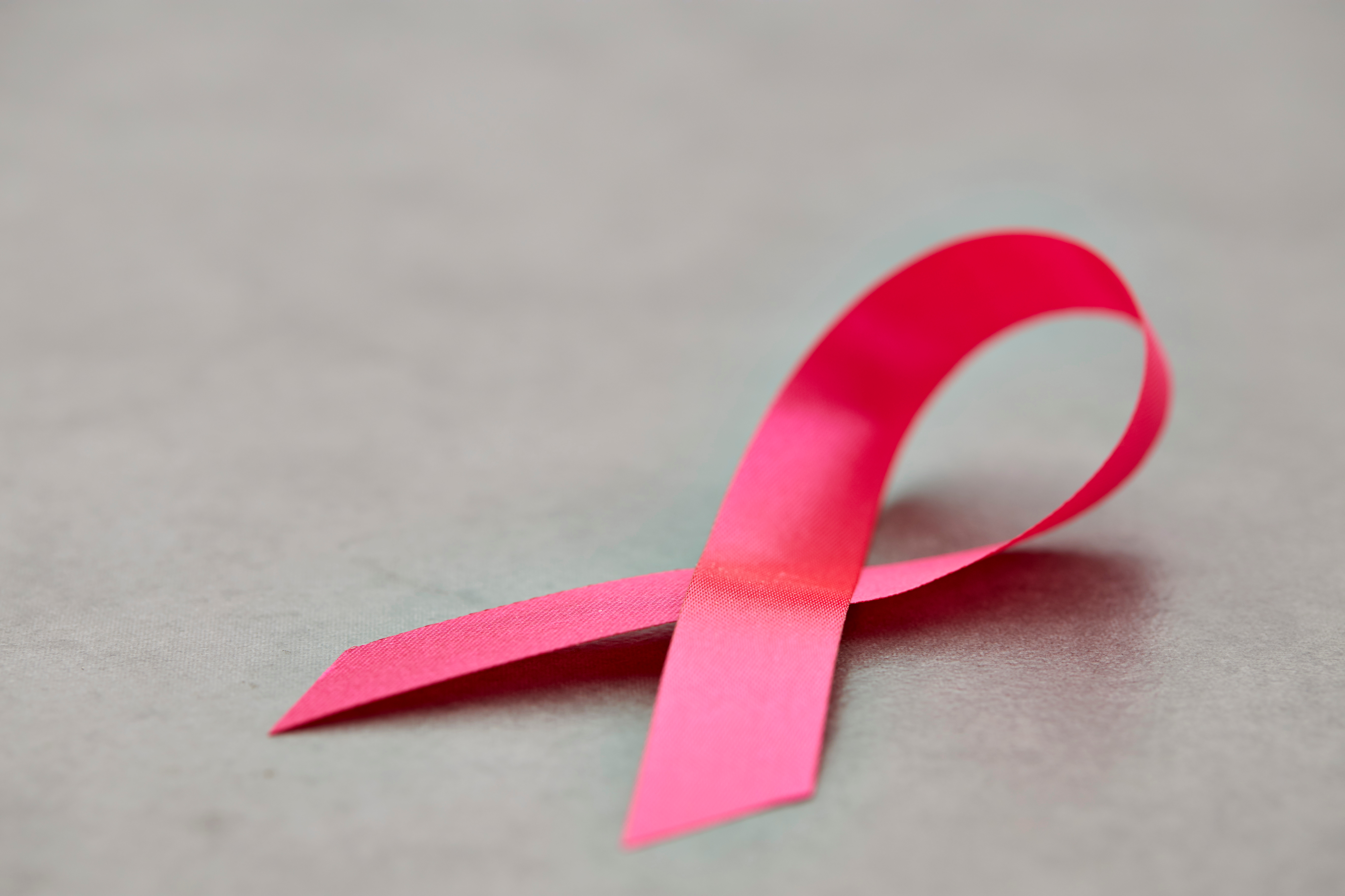 Close-Up Of Aids Awareness Ribbon On Table