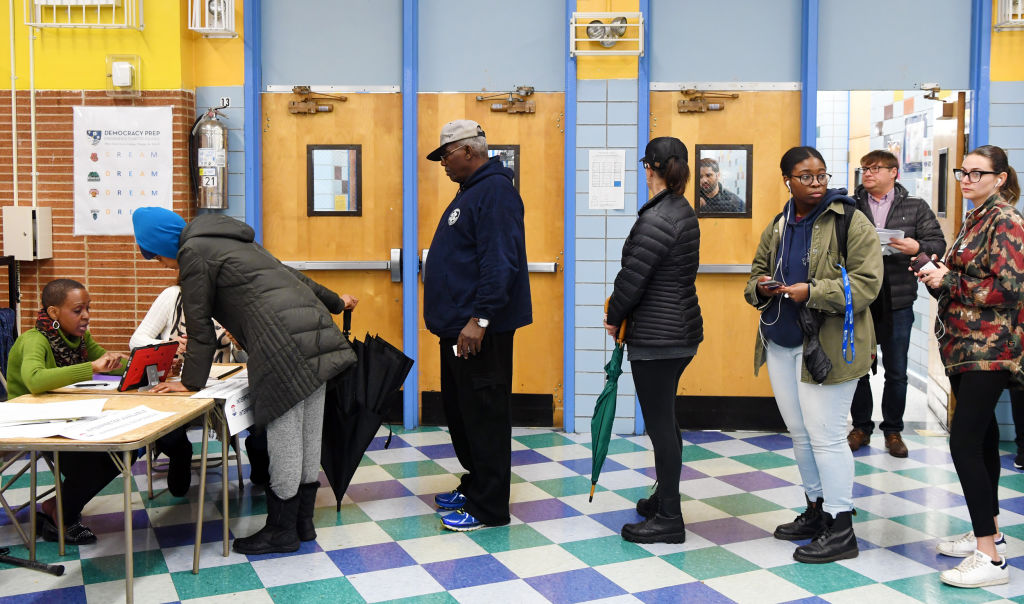 Voters register at a polling station in Manhattan of New York
