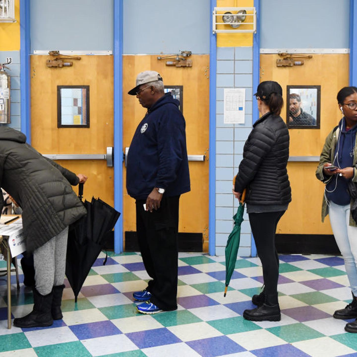 Voters register at a polling station in Manhattan of New York