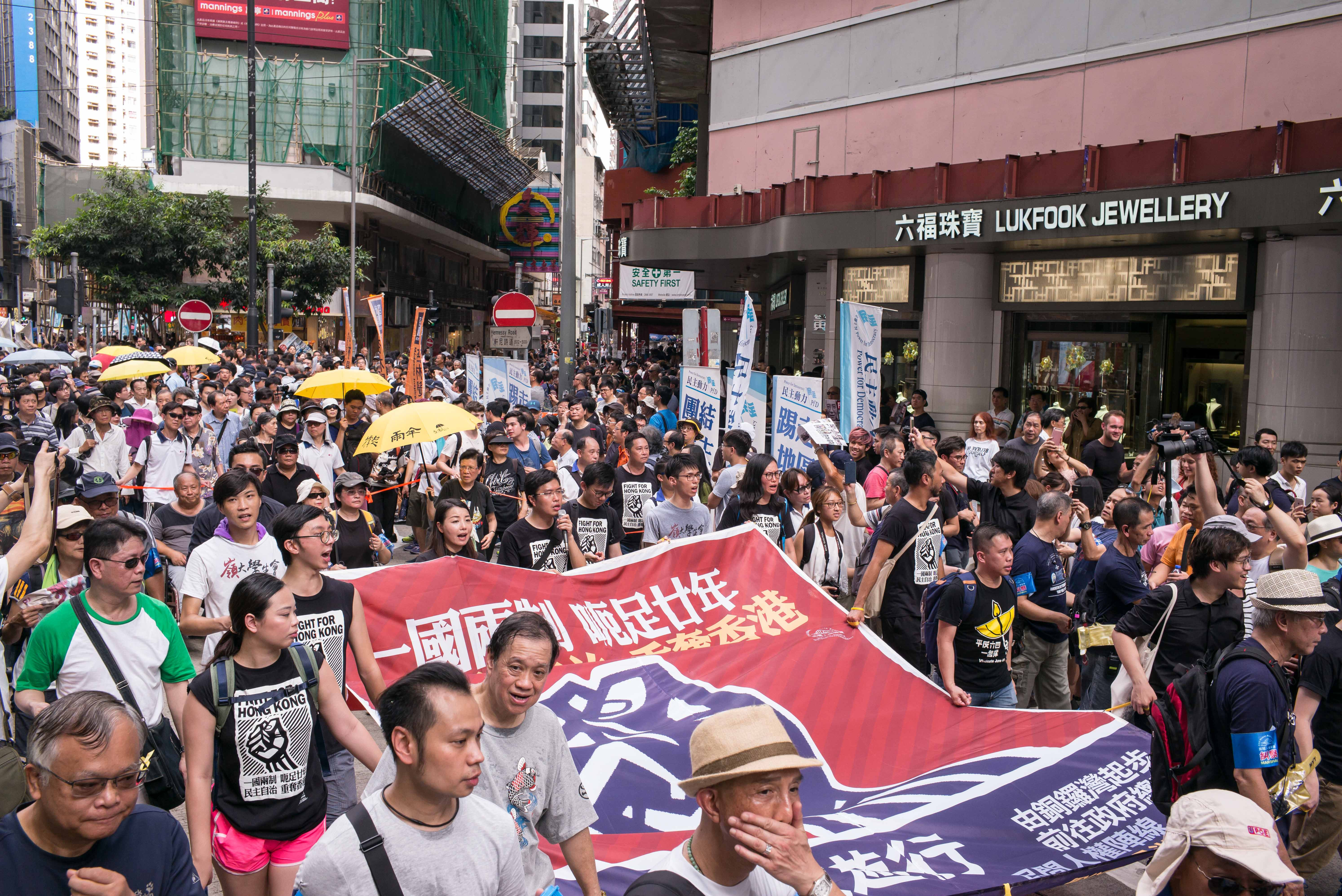 Protesters March On The Street As Hong Kong's New Government Takes Power