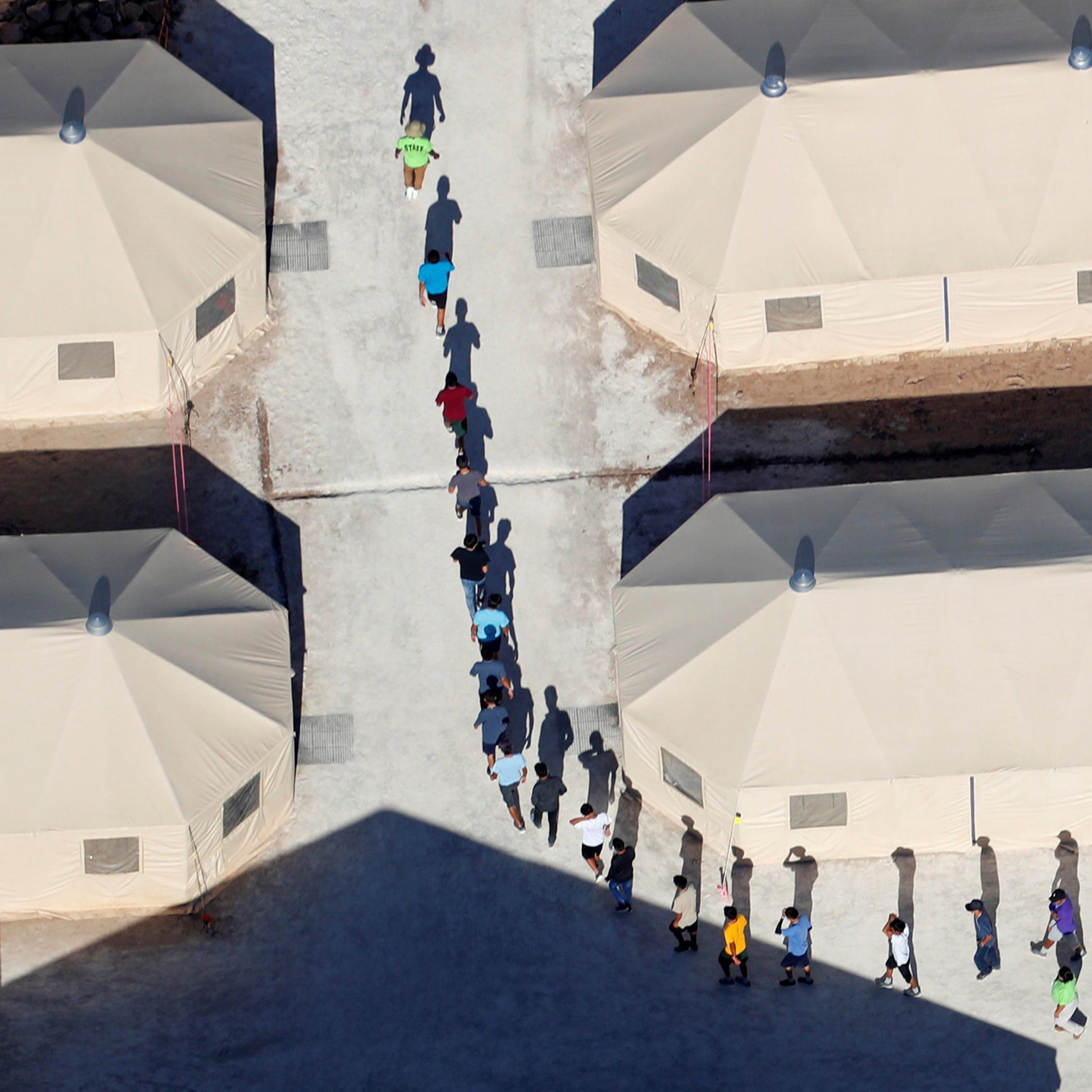 Immigrant children walk in single file