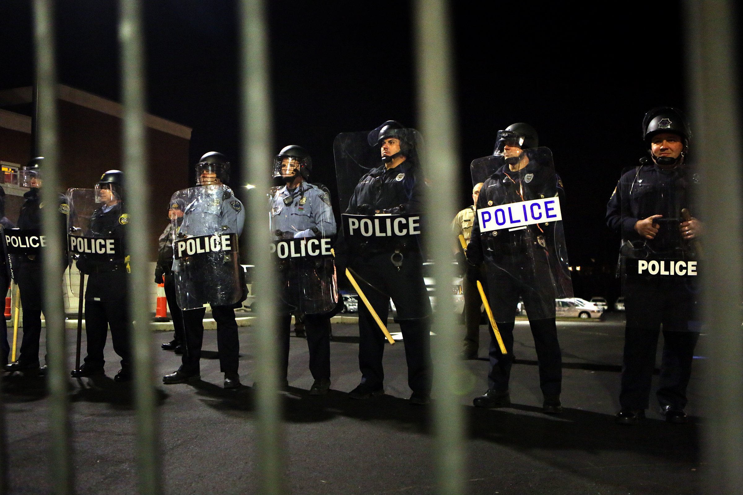 Police form a line opposite of protesters in front of the police station on Nov. 19, 2014.