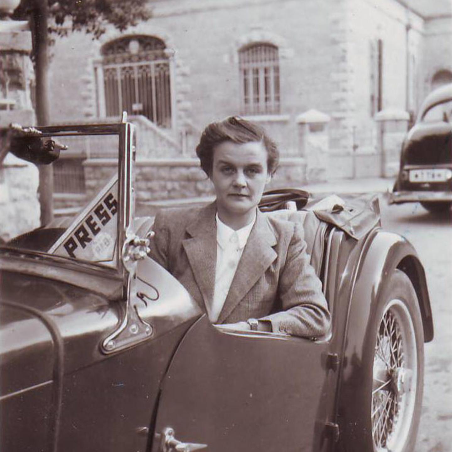 Clare Hollingworth in a car, likely late 1940s, early 1950s.