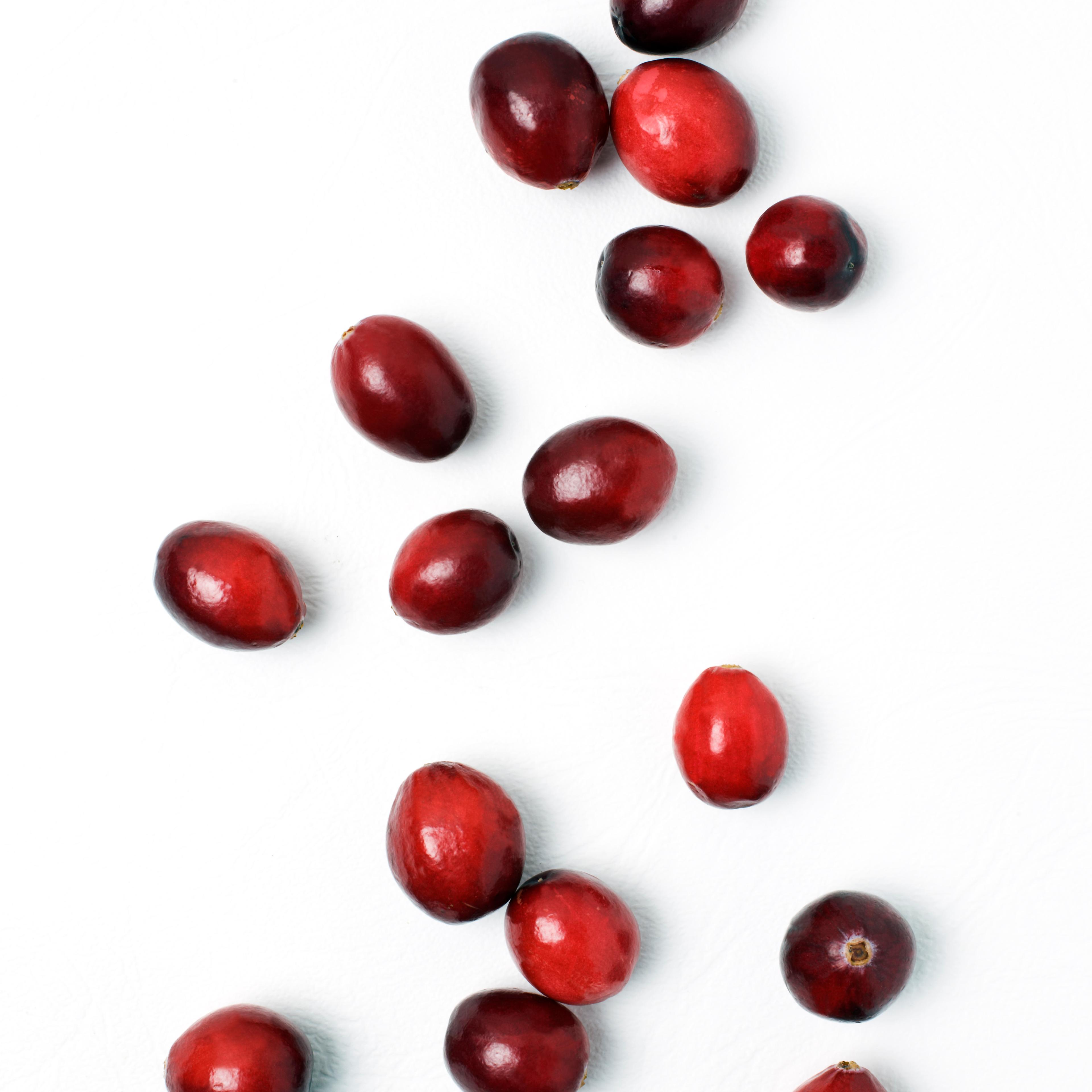Cranberries against white background