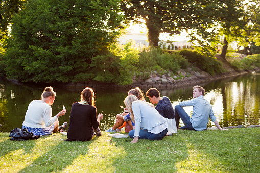 friends-sitting-riverbank