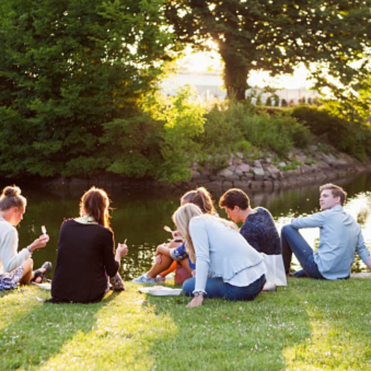 friends-sitting-riverbank