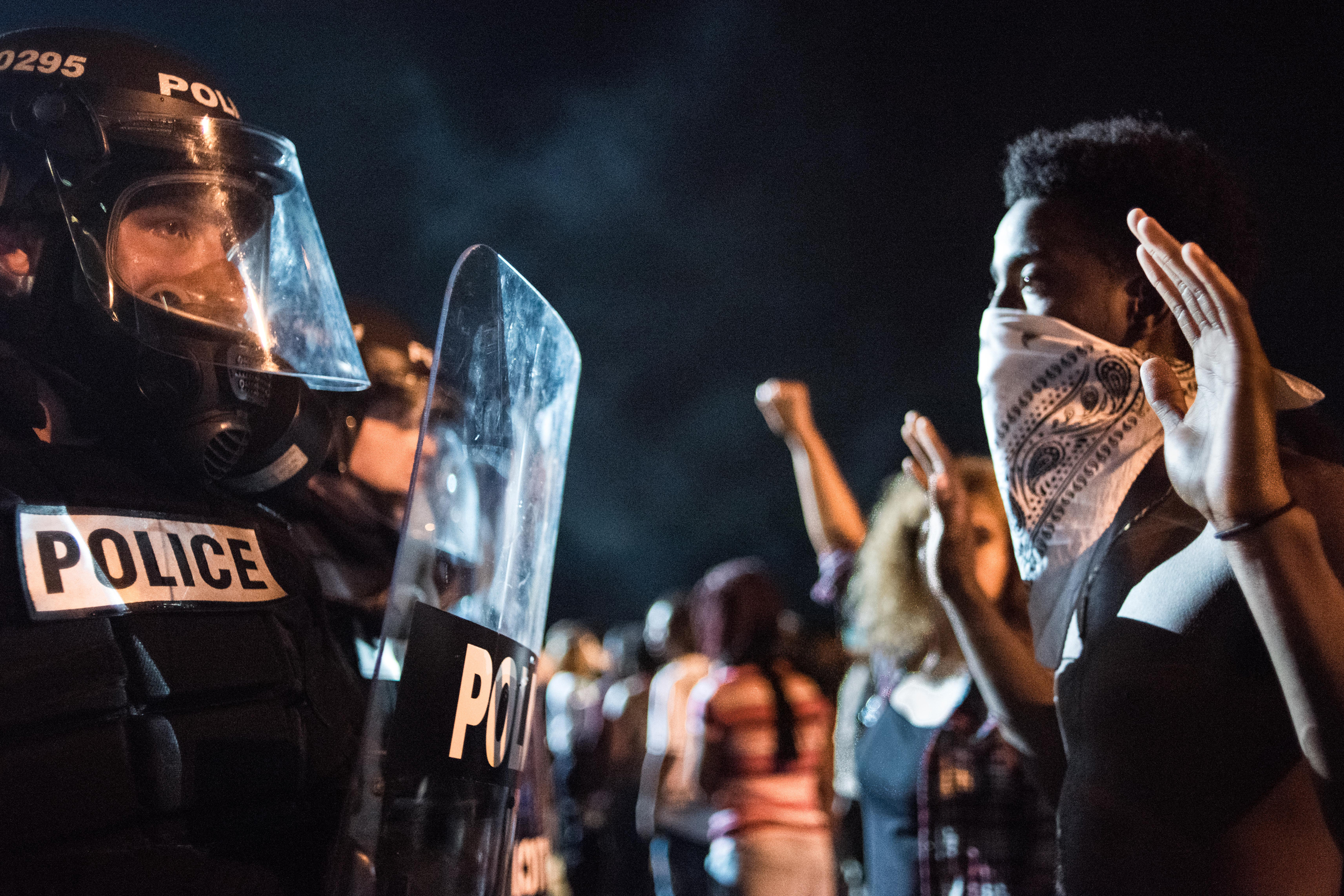 Police officers face off with protesters following the fatal shooting of 43-year-old Keith Lamont Scott by a police officer in Charlotte, NC., on Sept. 21, 2016.