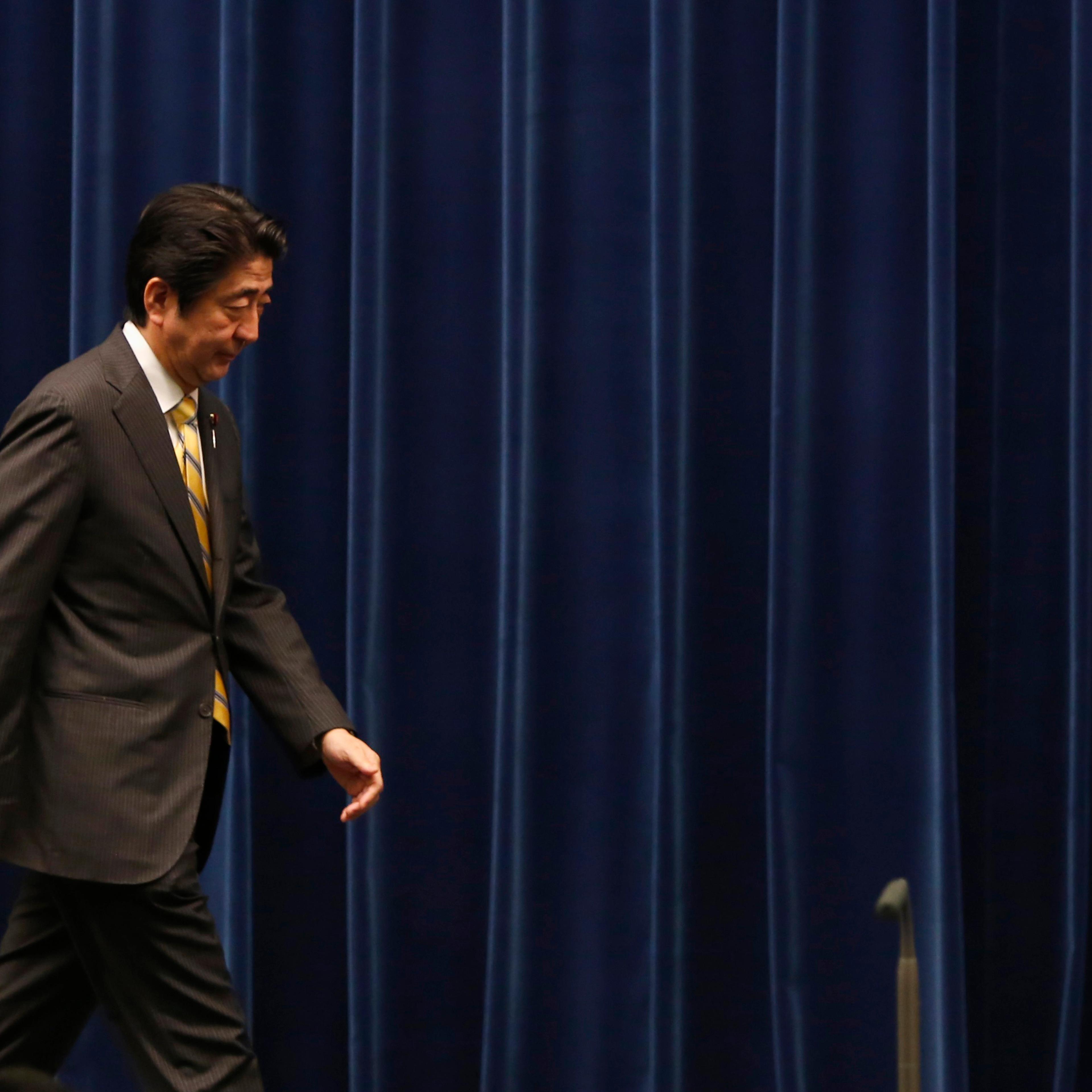 Japan's Prime Minister Shinzo Abe leaves a news conference at his official residence in Tokyo