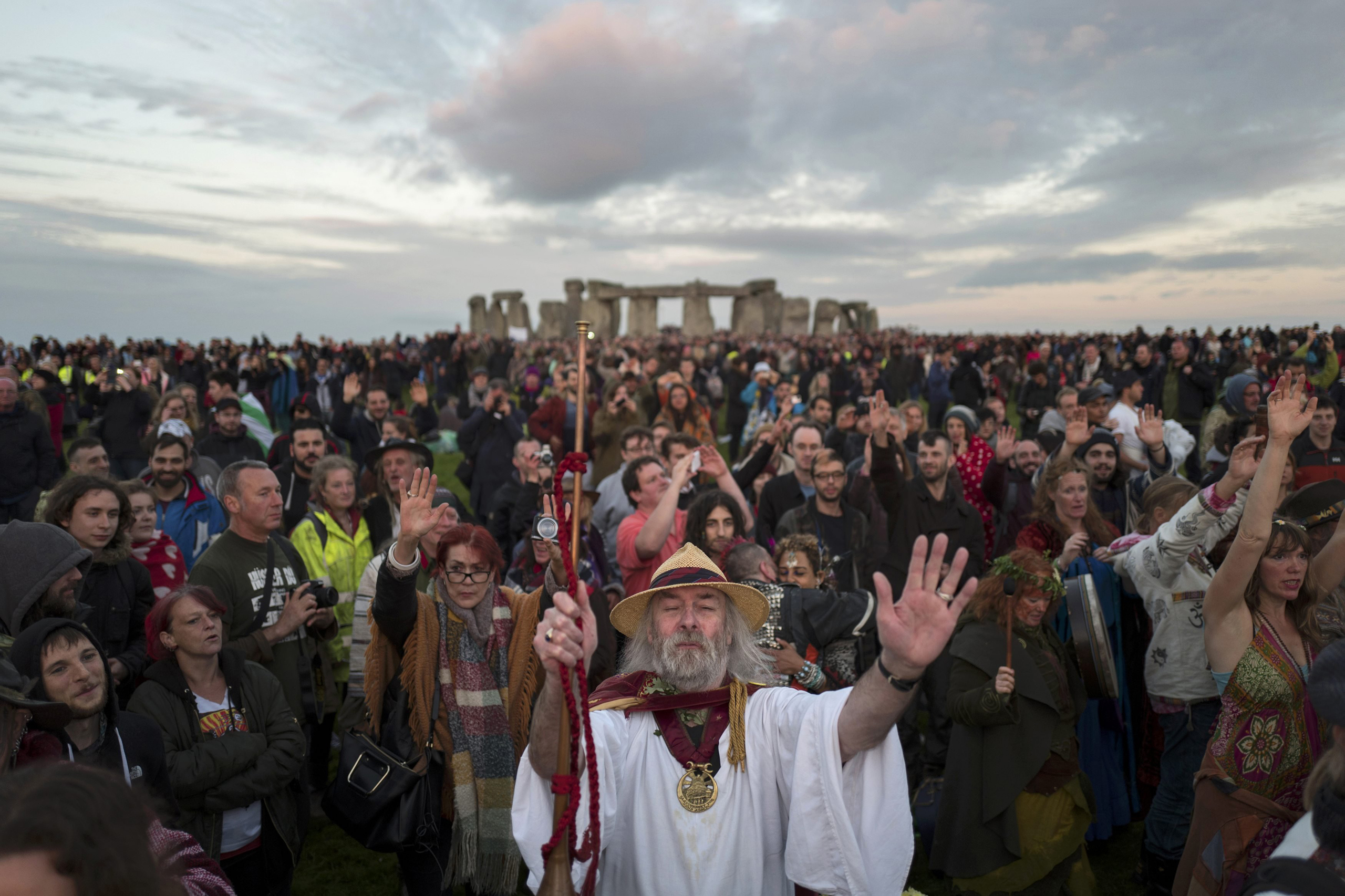 Revellers celebrate the summer solstice at Stonehenge on Salisbury Plain in southern England, on June 21, 2016.