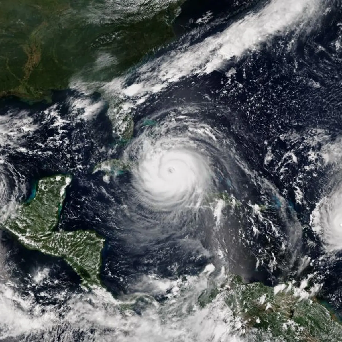 Satellite image of Hurricane Katia (left) making landfall over the Mexican state of Veracruz, Hurricane Irma (center) approaching Cuba, and Hurricane Jose reaching peak intensity on September 8, 2017