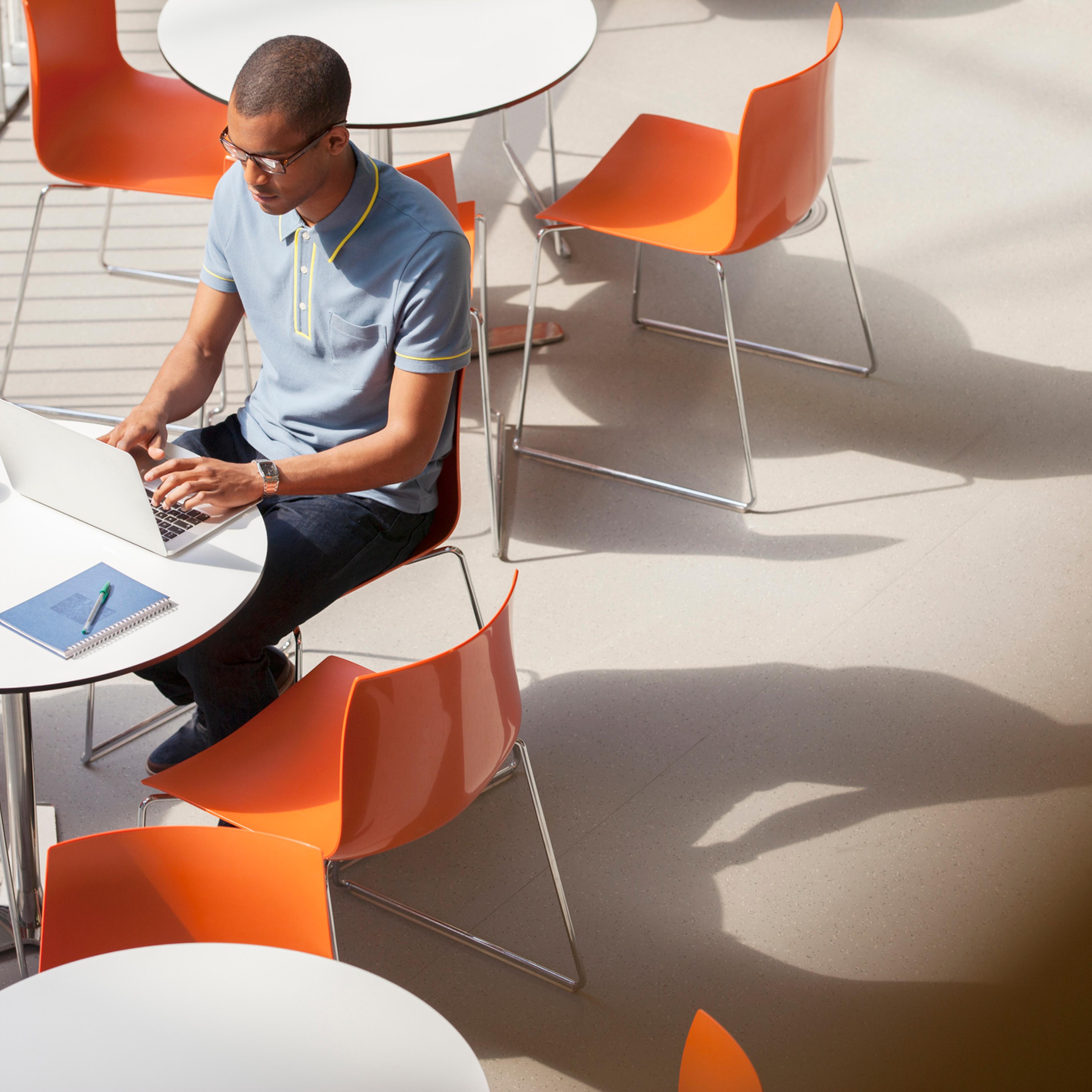 Businessman working on laptop in cafe