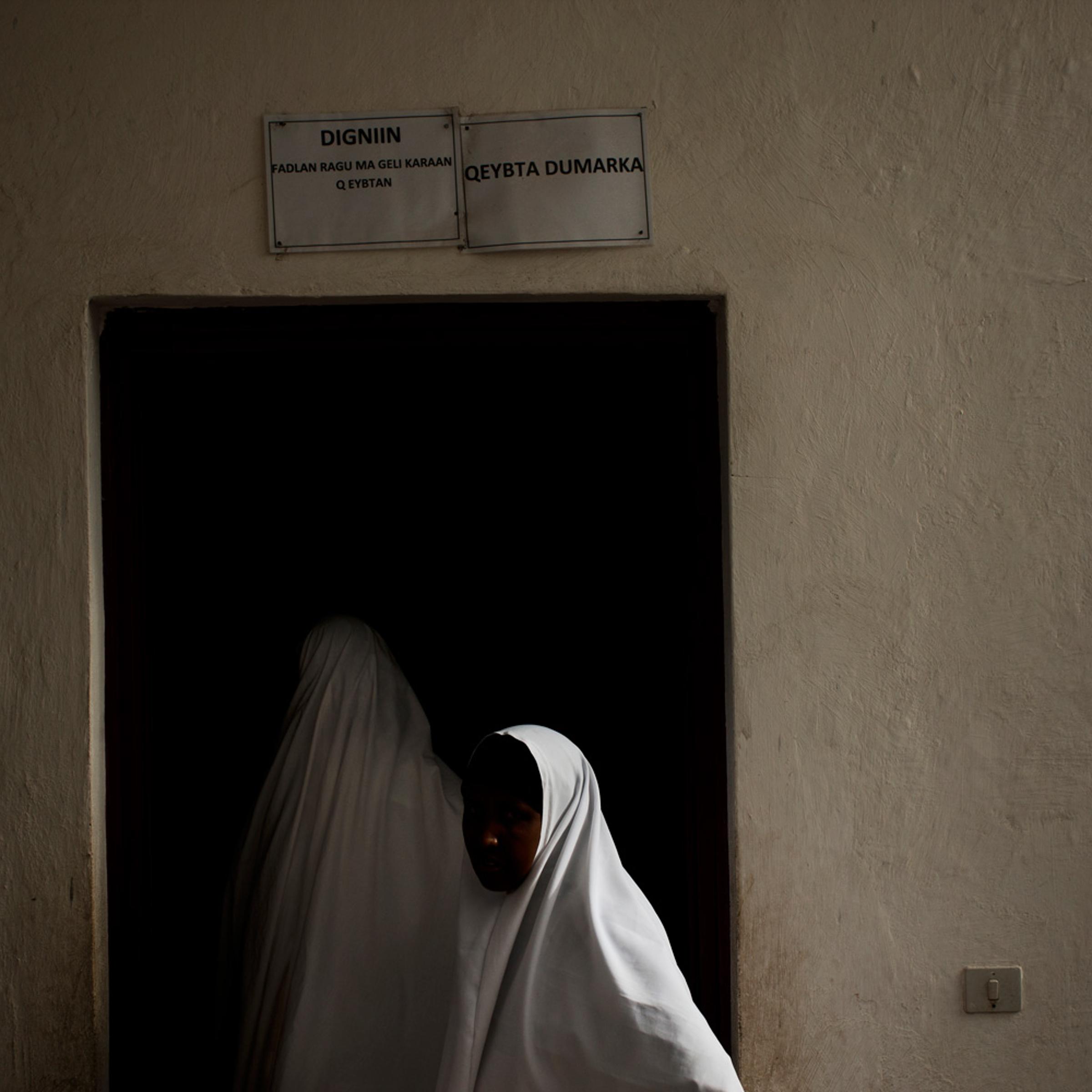 <i>The following photos were taken in June 2012</i></br> Women enter a hospital in Mogadishu, which has become more active since Al-Shabaab was pushed out of the city.