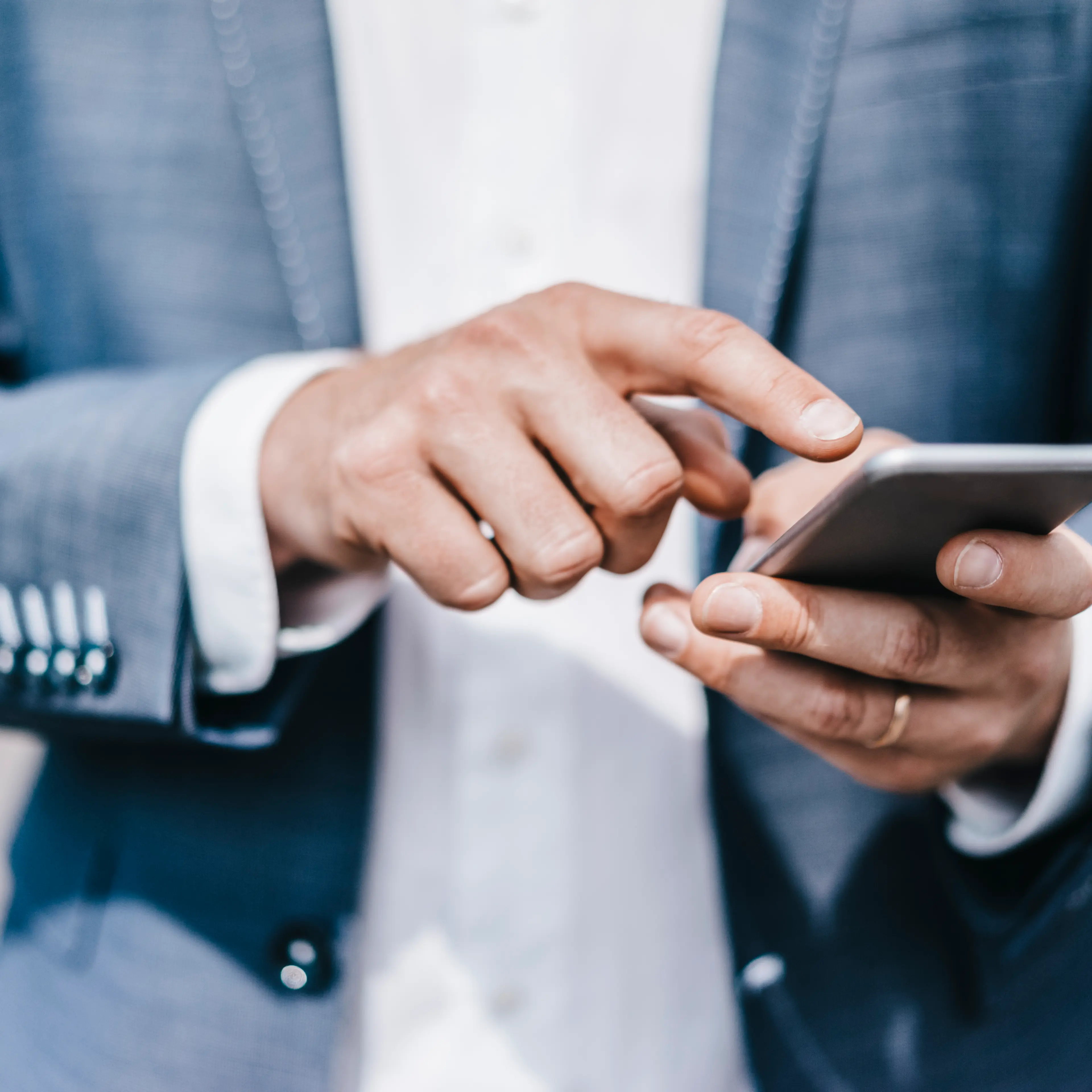 Close-up of businessman using cell phone