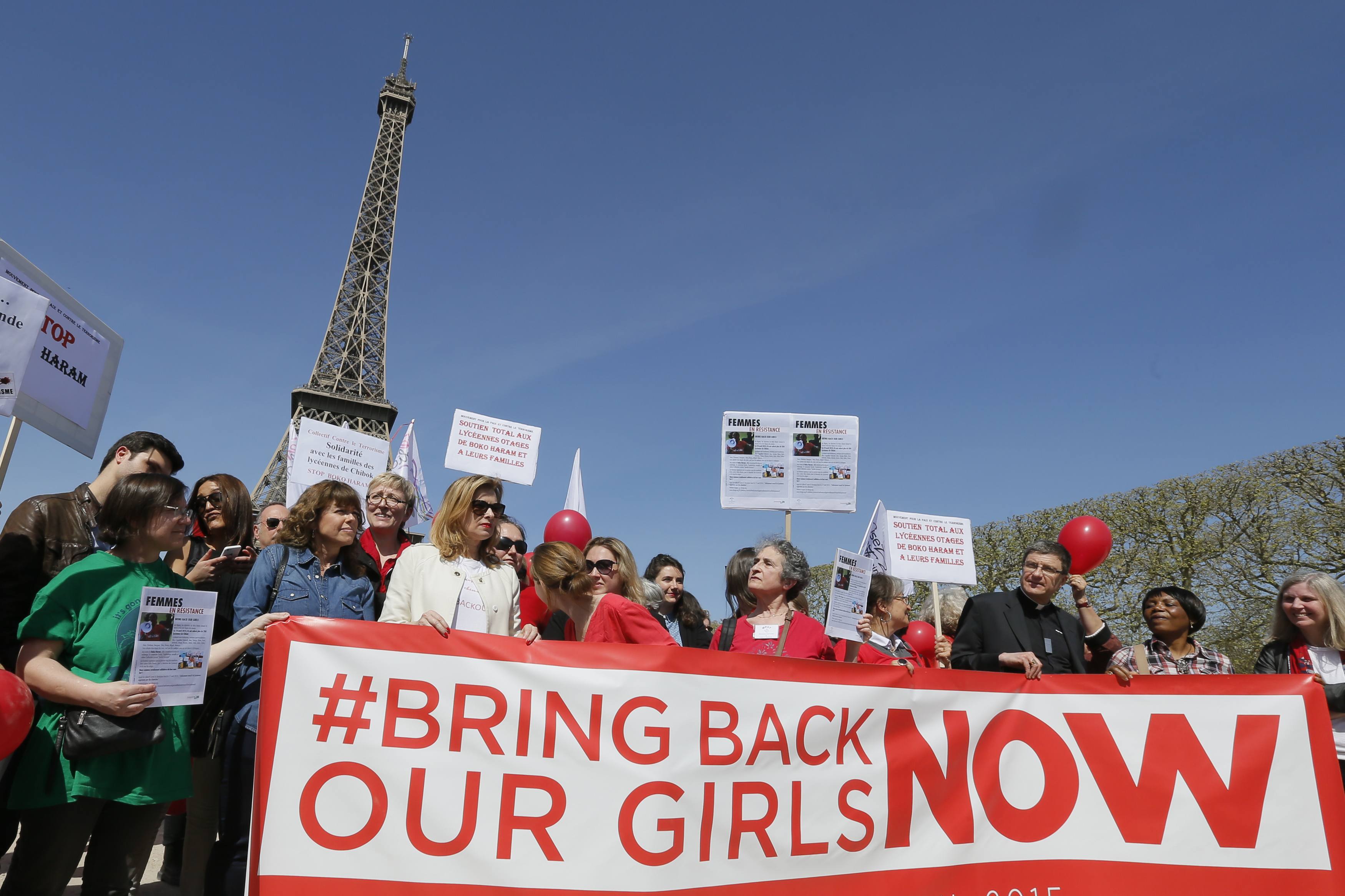 Former French first lady Valerie Trierweiler (3rdL) attends a gathering "Bring Back Our Girls" near the Eiffel Tower in Paris on April 14, 2015 to mark one year since more than 200 schoolgirls were kidnapped in Chibok, north-eastern Nigeria, by Nigerian 