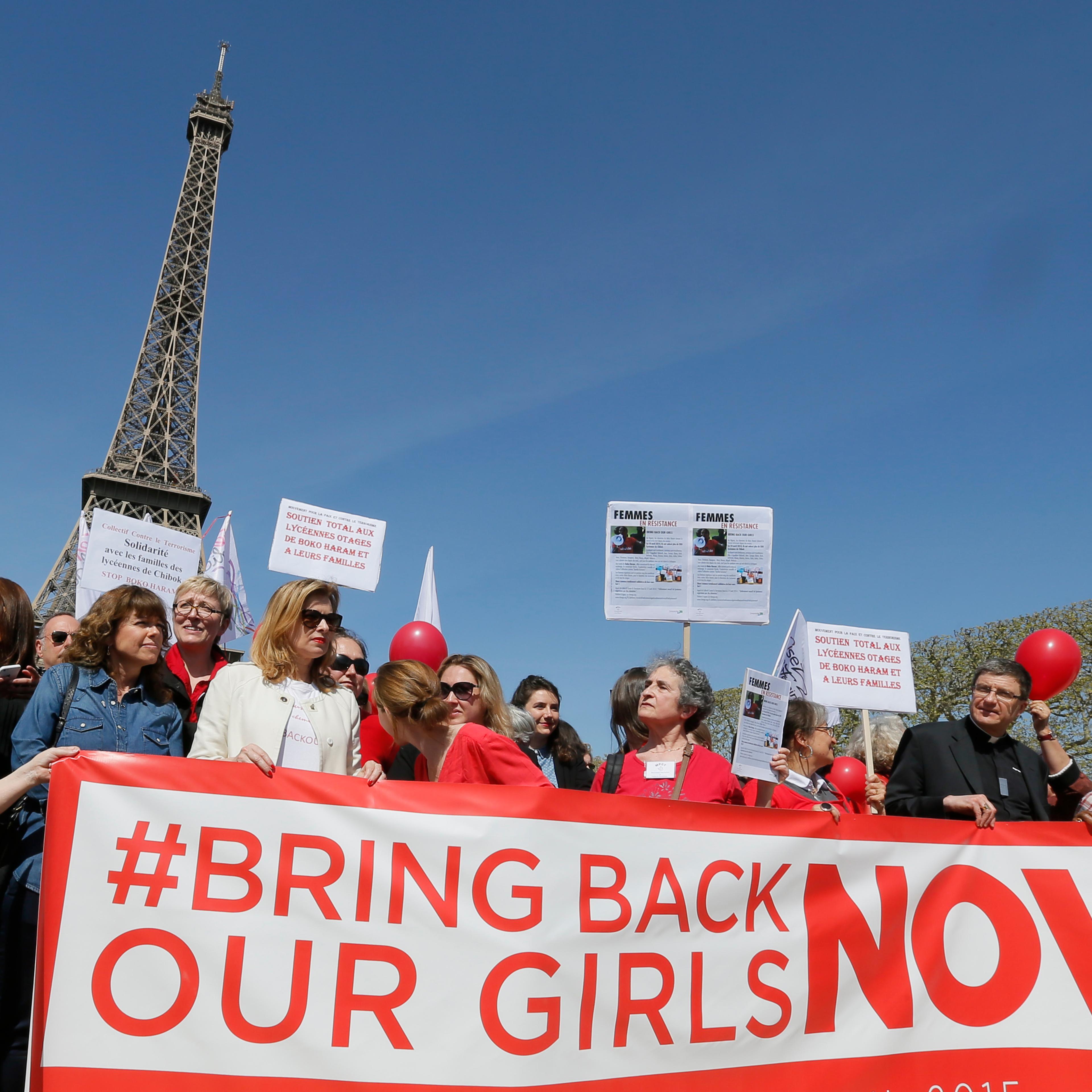Former French first lady Valerie Trierweiler (3rdL) attends a gathering "Bring Back Our Girls" near the Eiffel Tower in Paris on April 14, 2015 to mark one year since more than 200 schoolgirls were kidnapped in Chibok, north-eastern Nigeria, by Nigerian