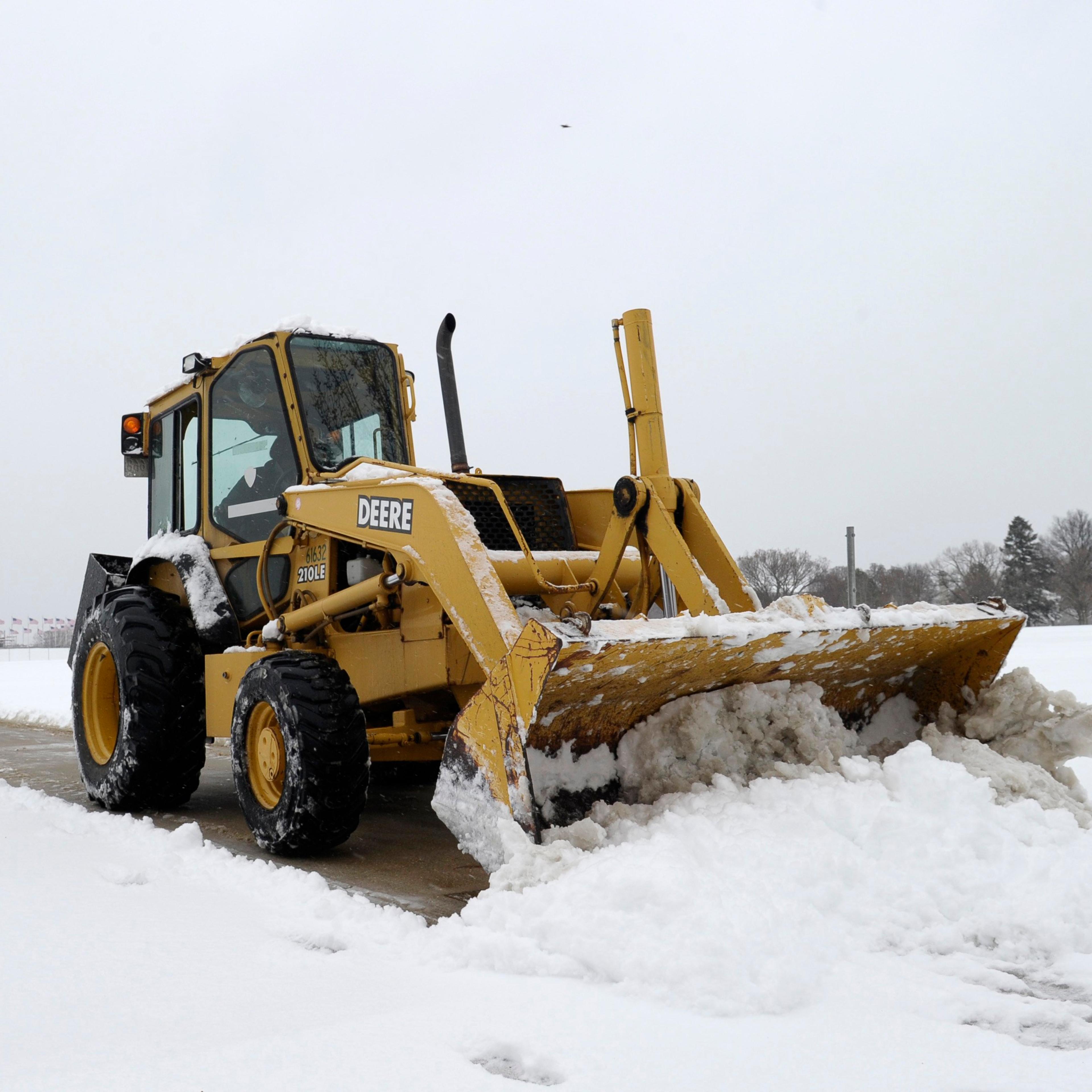 A snow plow clears the area around the Washington Monument in Washington, D.C. on March 17, 2014.