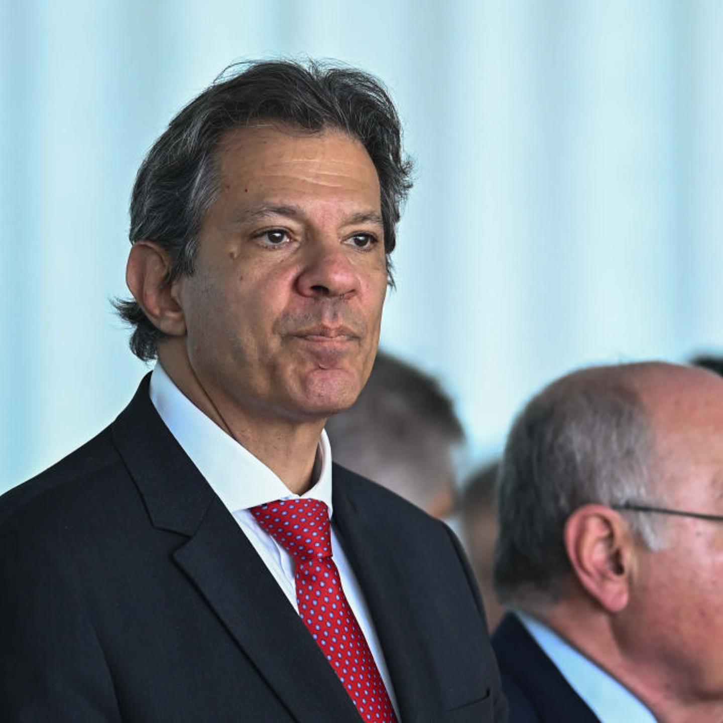 Fernando Haddad, Brazil's finance minister, standing at a news conference