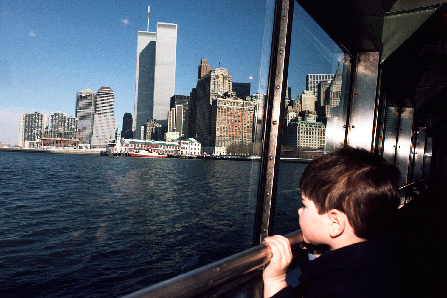 Charlie looking out the window of the Statue of Liberty Ferry, February 1985.