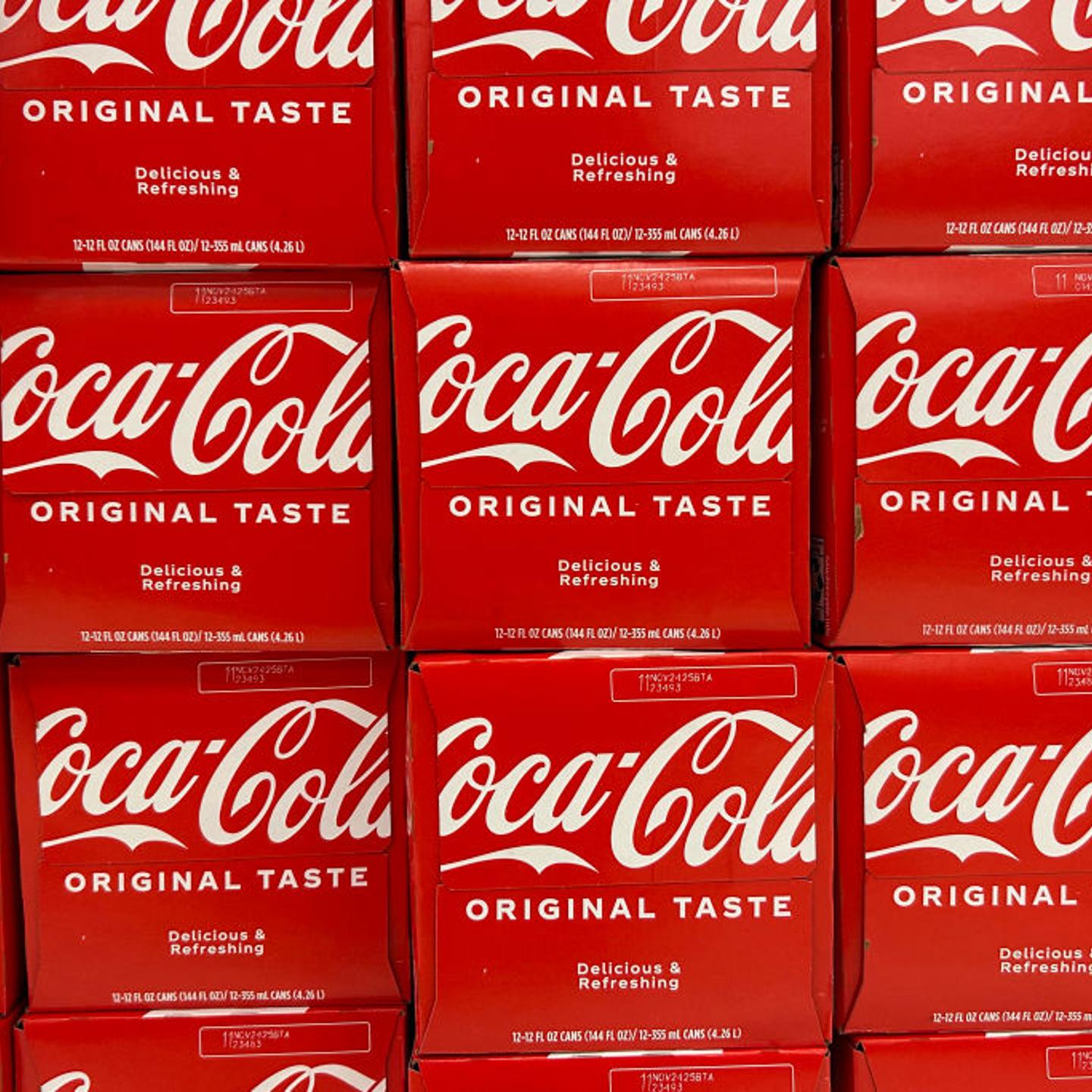 Twelve-pack cases of canned Coca-Cola