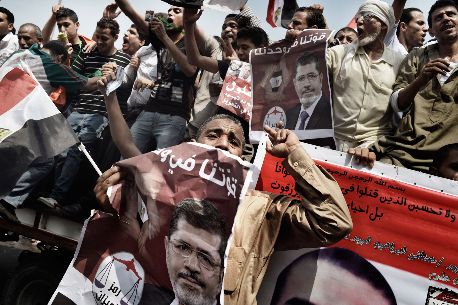 Supporters of Egypt's Muslim Brotherhood candidate Mohamed Morsy celebrate in Tahrir square after the Brotherhood claimed victory in the presidential vote. June 18, 2012.