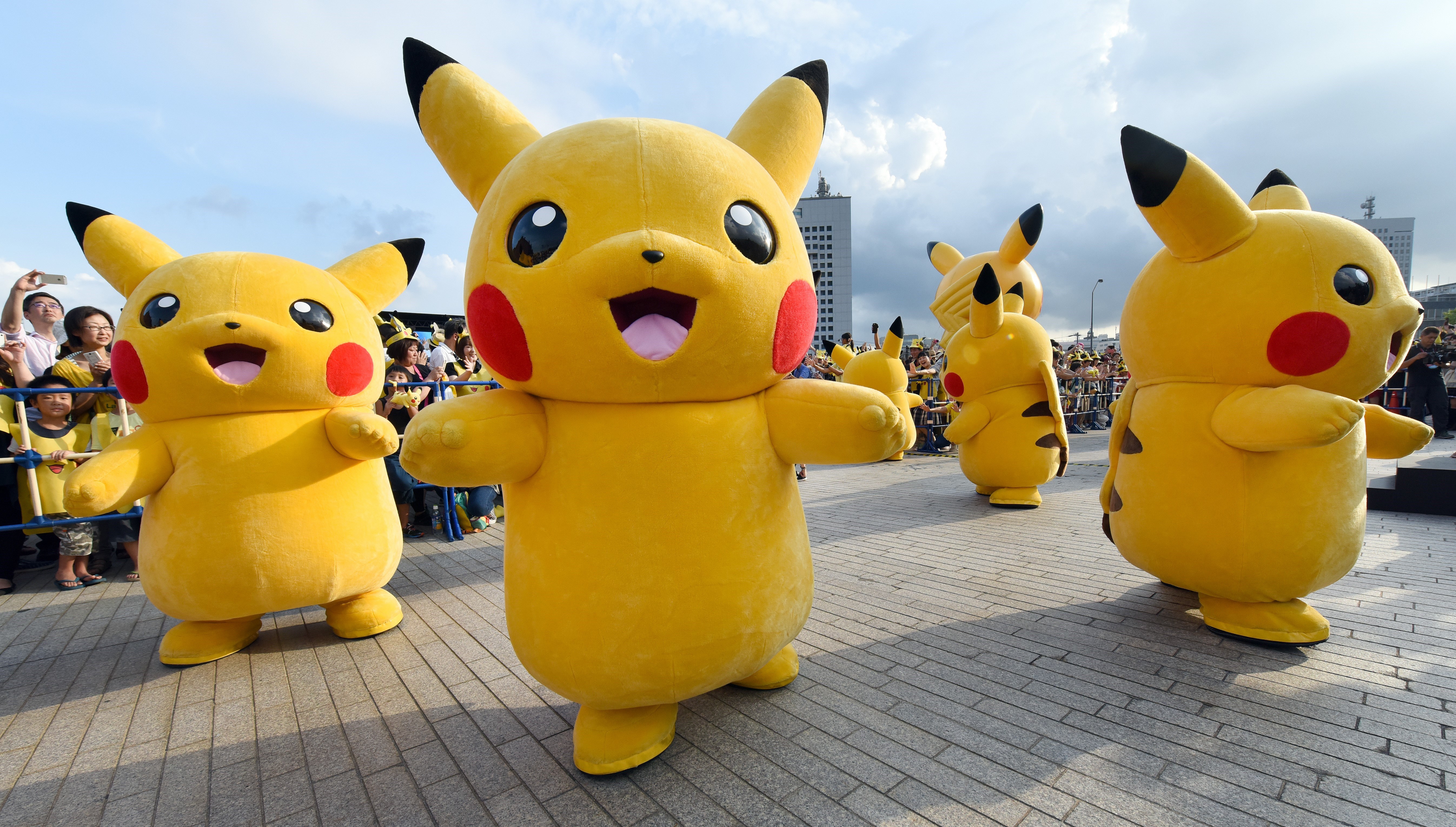 Dozens of people dressed up as Pikachu, the famous character of Nintendo's videogame software Pokemon, dance with fans as the final of a nine-day "Pikachu Outbreak" event takes place to attract summer vacationers in Yokohama, in suburban Tokyo, on August