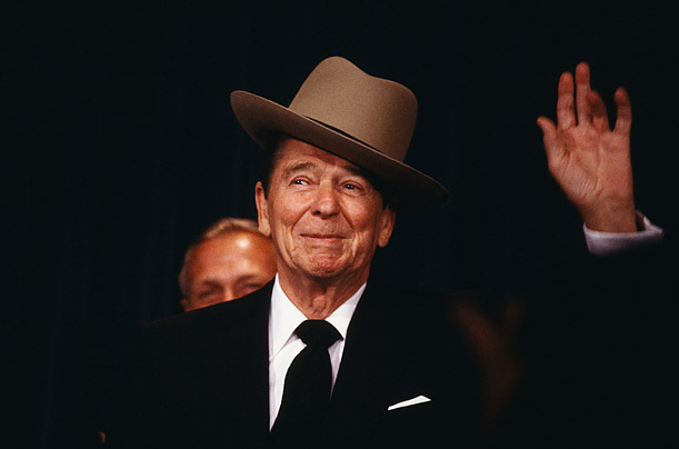 <b>Crowd Pleaser</b> "Reagan was the only politician I've ever known who dared take a hat, oblivious to its size, cock it to the side and charm everyone. Here, he's seen speaking before the National Law Enforcement Council, where he dons a trooper's hat presented to him by the association."