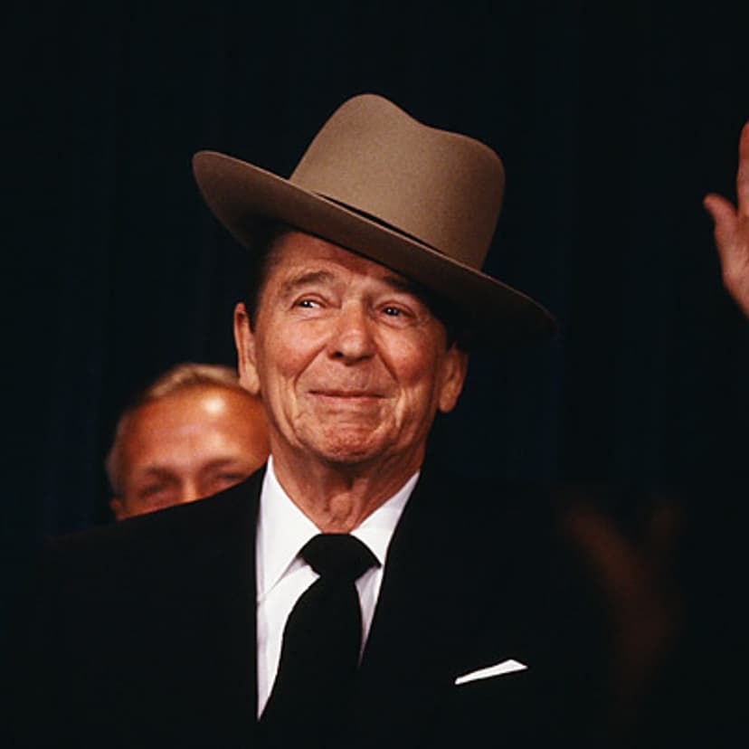 <b>Crowd Pleaser</b> "Reagan was the only politician I've ever known who dared take a hat, oblivious to its size, cock it to the side and charm everyone. Here, he's seen speaking before the National Law Enforcement Council, where he dons a trooper's hat presented to him by the association."