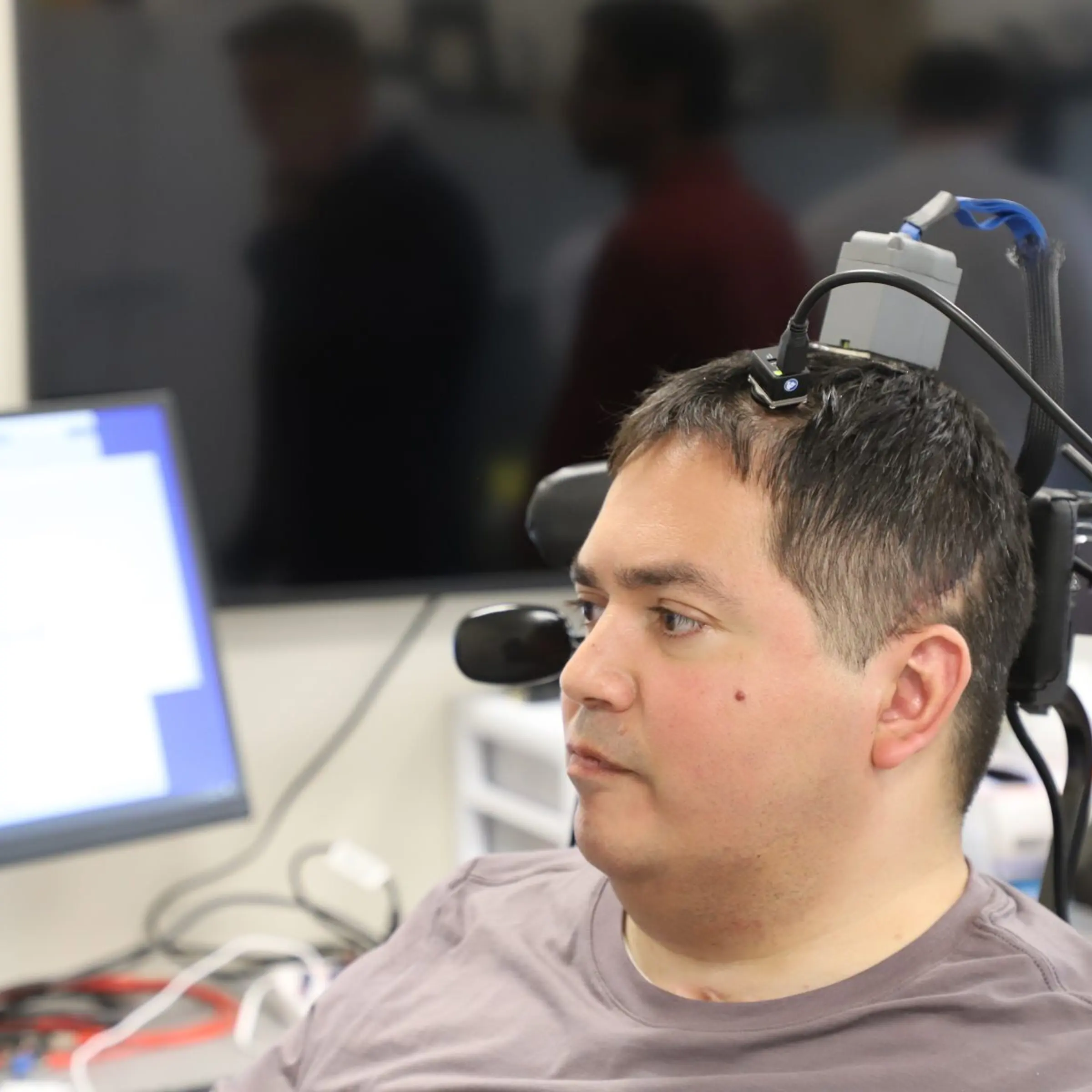 Keith Thomas, a man living with paralysis who is relearning how to move and feel.
