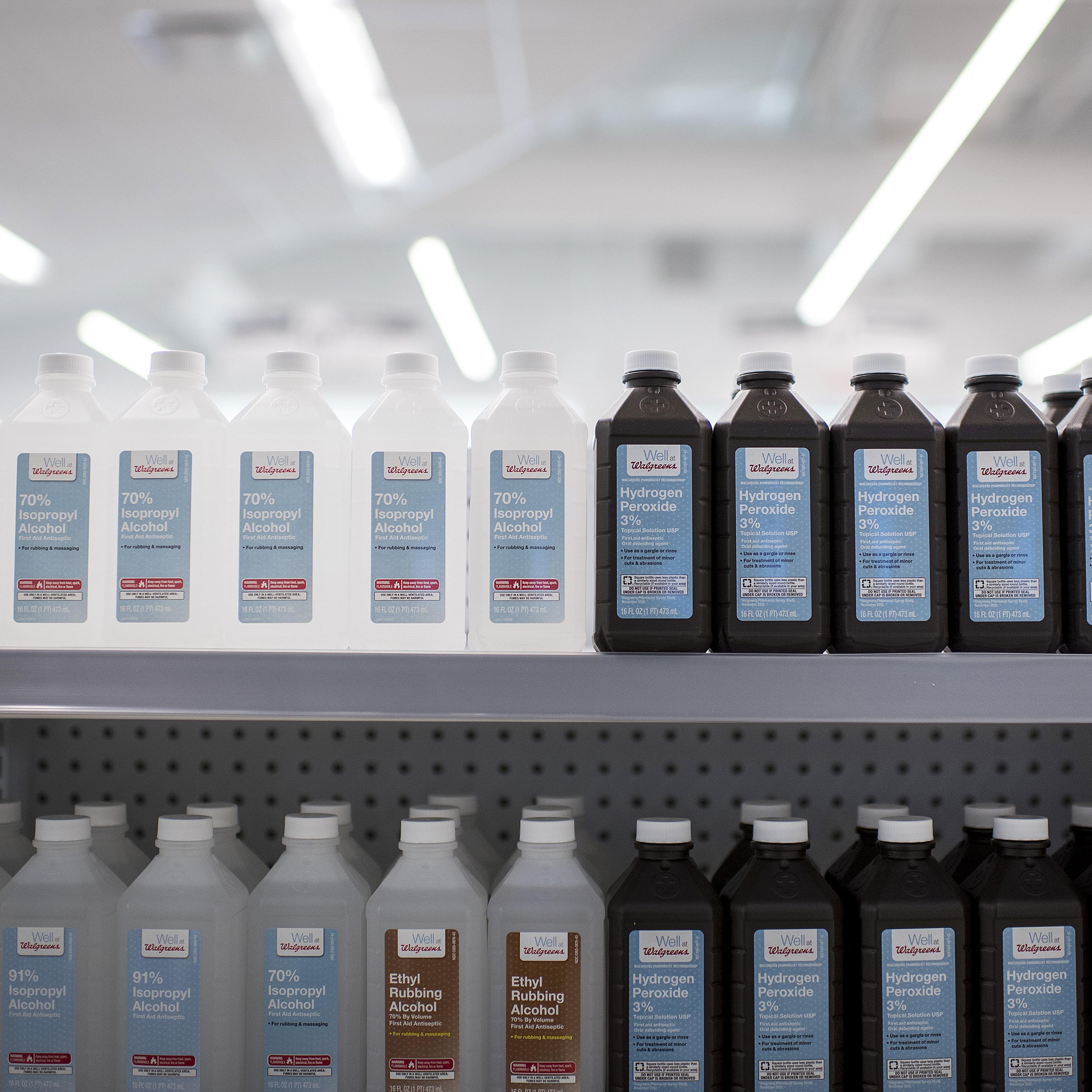 Bottles of rubbing alcohol and hydrogen peroxide are displayed for sale at a Walgreens Boots Alliance Inc. store in Elmwood Park, Illinois, U.S., on Tuesday, April 5, 2016.
