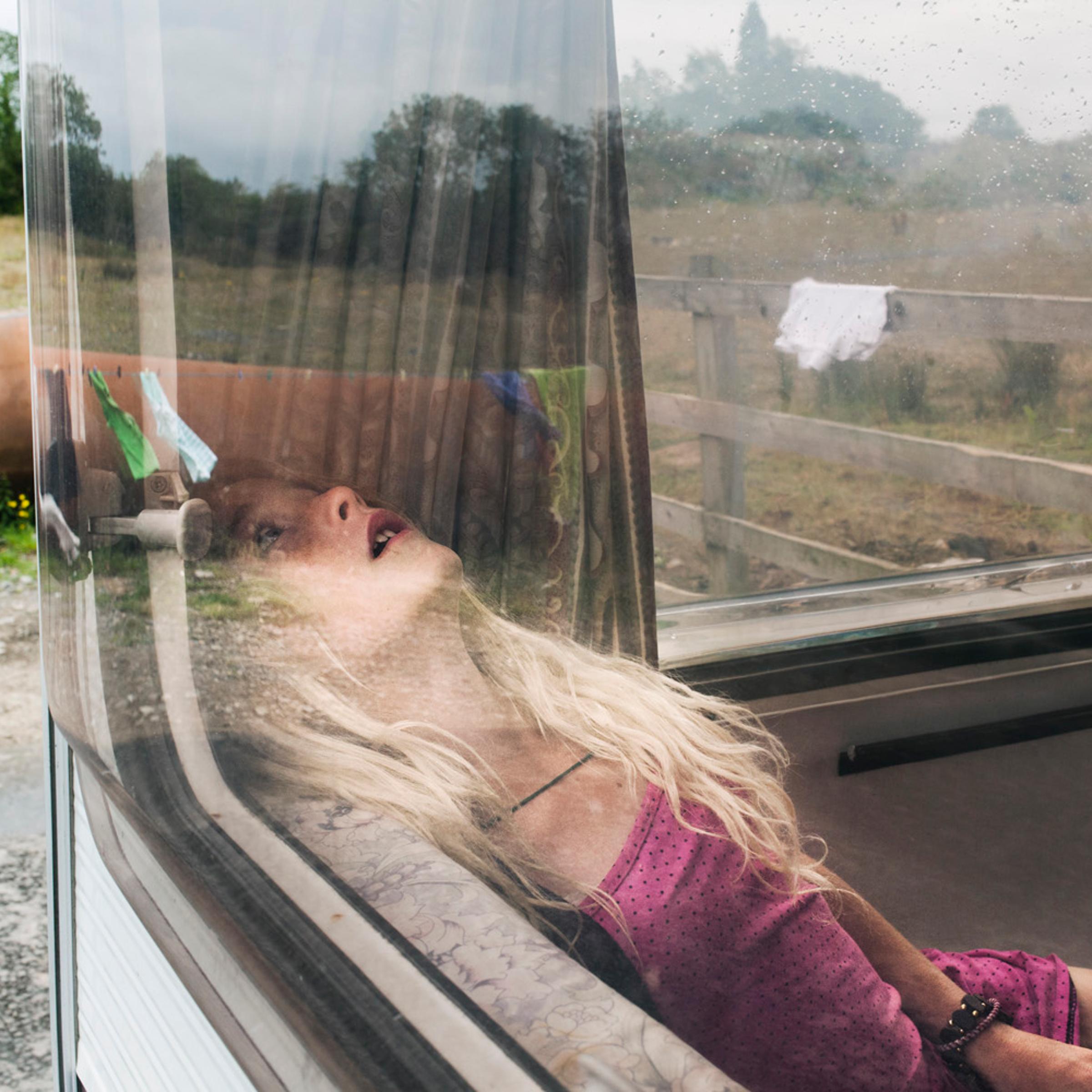 Pamela seen in the caravan. From the series, The Travellers.
