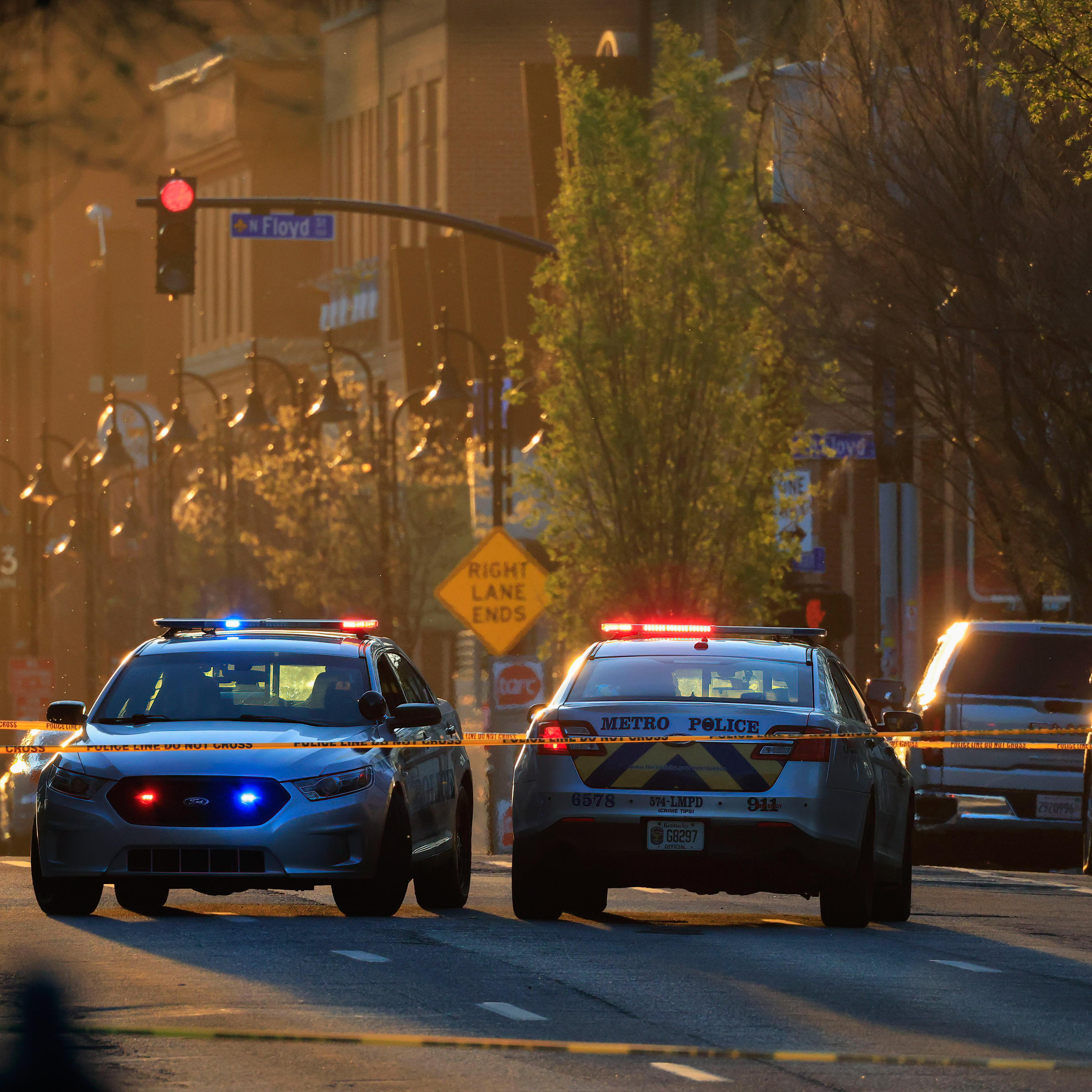 Police cars block Main Street in Louisville, KY, following a shooting in April 2023.