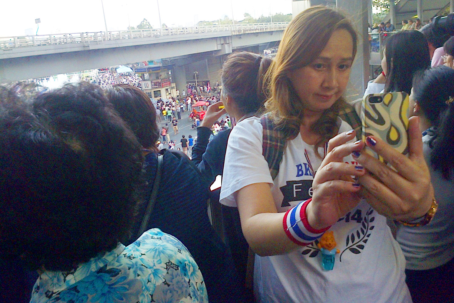 Protester snaps selfie at anti-government demonstration at Bangkok's Victory Monument on Jan. 13