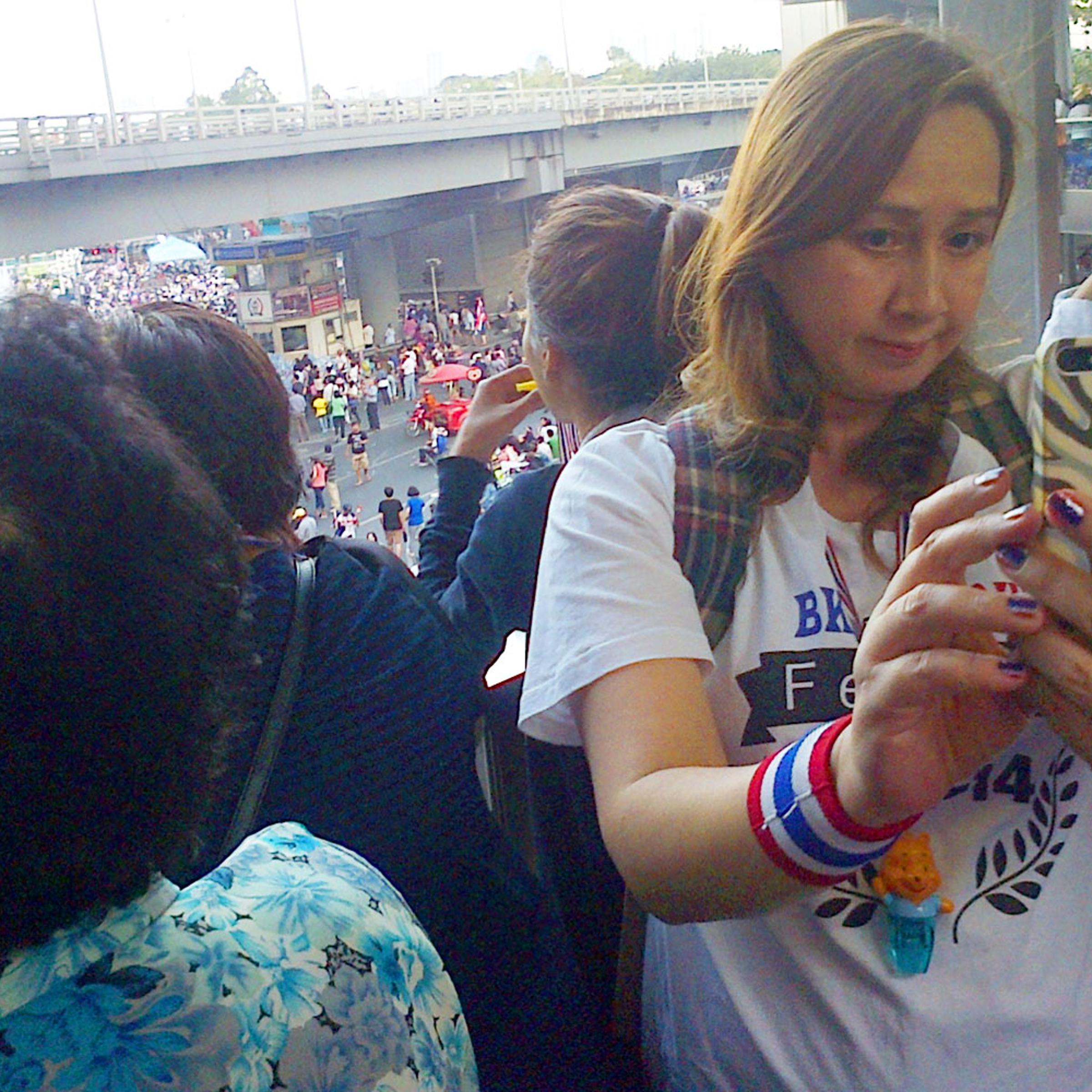 Protester snaps selfie at anti-government demonstration at Bangkok's Victory Monument on Jan. 13