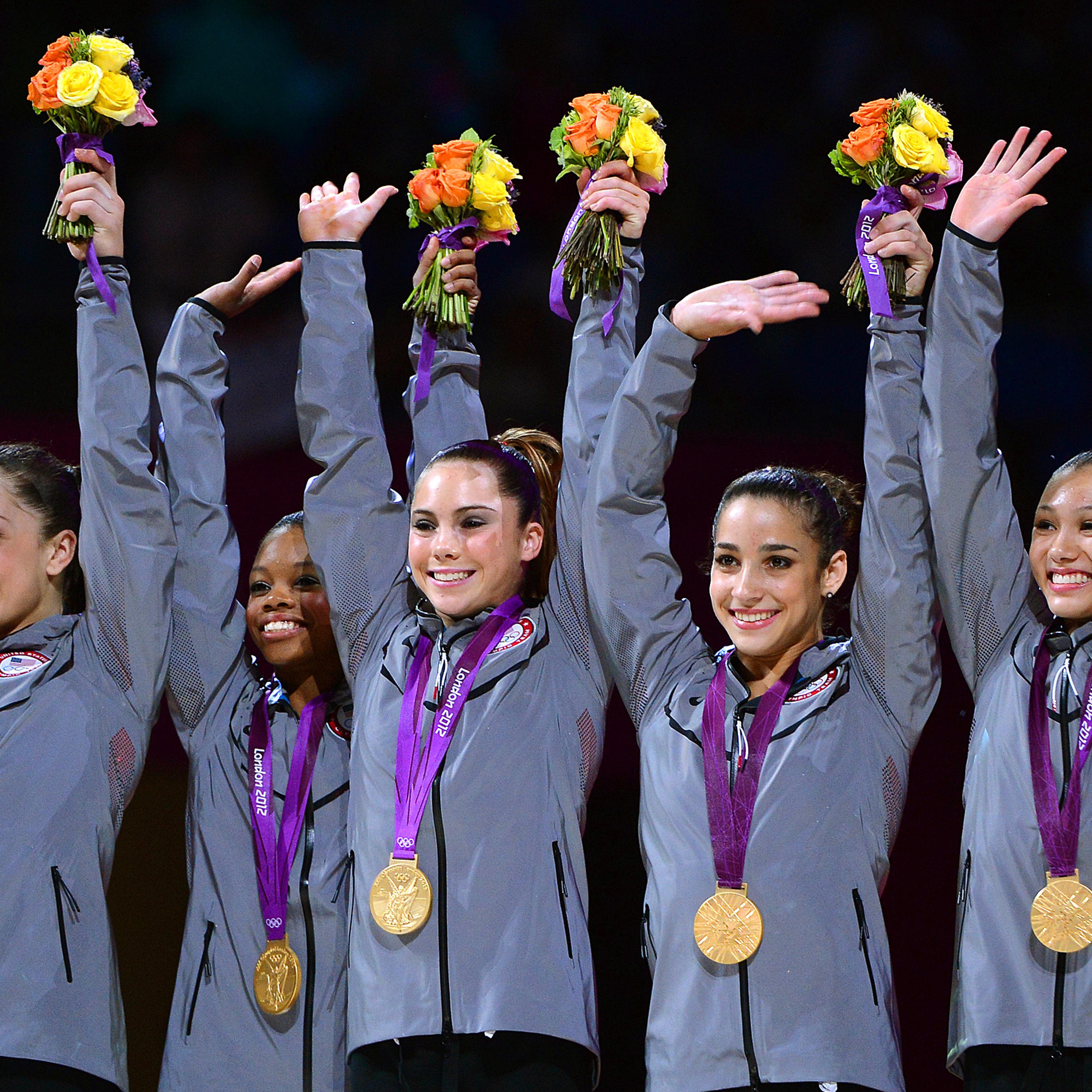McKayla Maroney, center, celebrates with her team after winning gold in the Women's Team Final at the 2012 London Olympics.